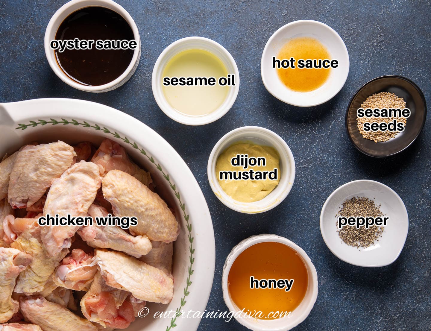 oyster sauce wings ingredients - oyster sauce, honey, dijon mustard, seasme oil, hot sauce, pepper, sesame seeds