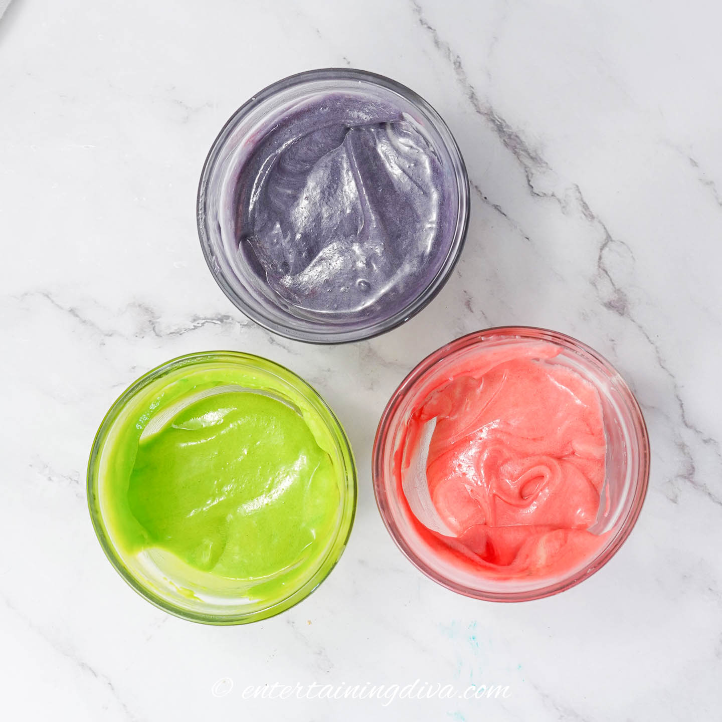 purple, green and pink batter in 3 small bowls