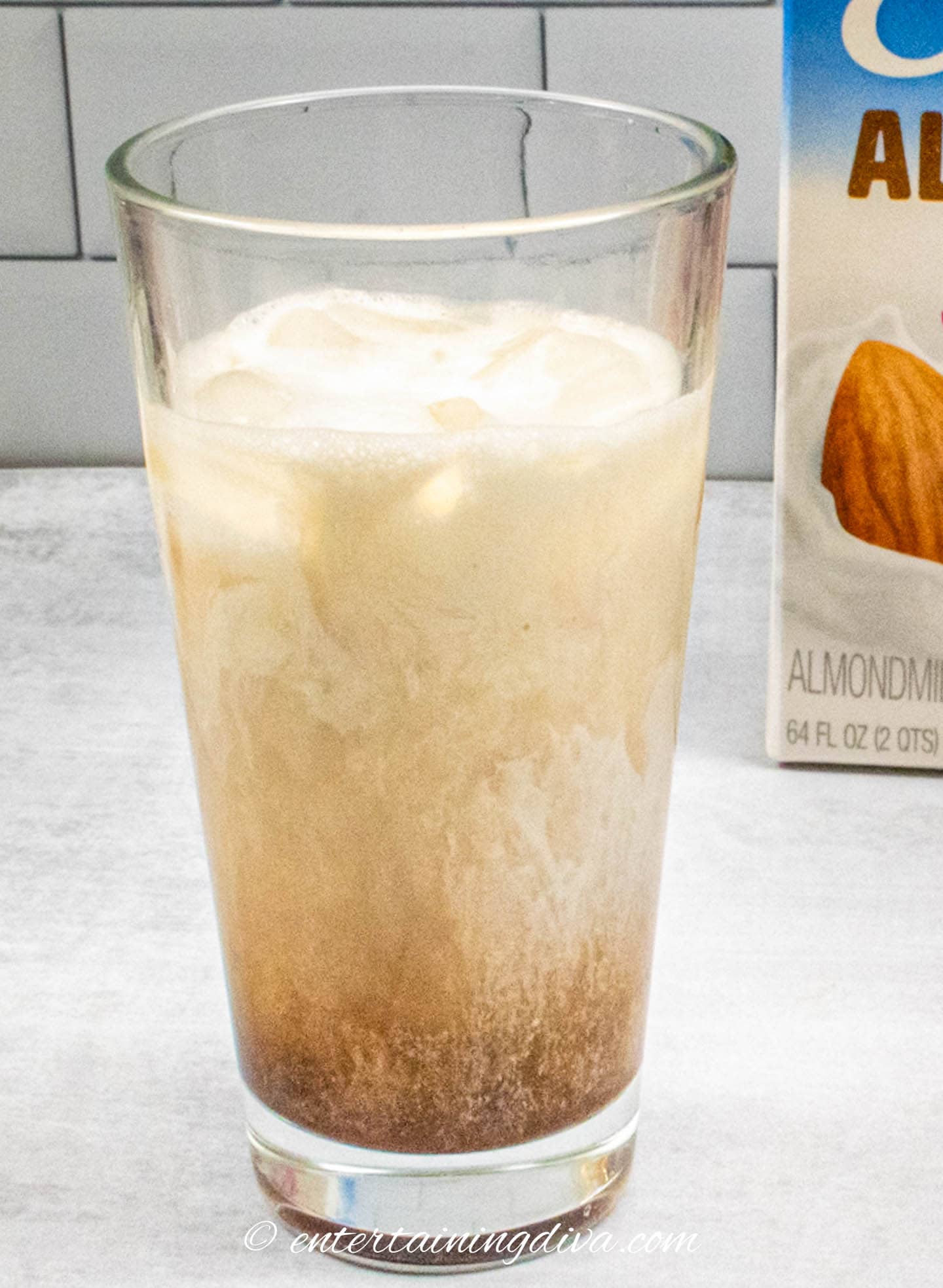 peanut butter whiskey cocktail ingredients in a glass