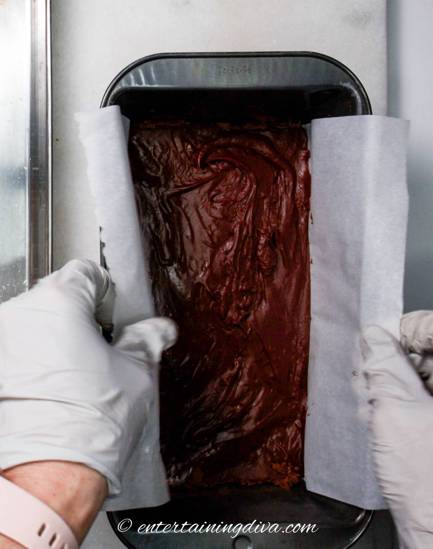 fudge being removed from the loaf pan