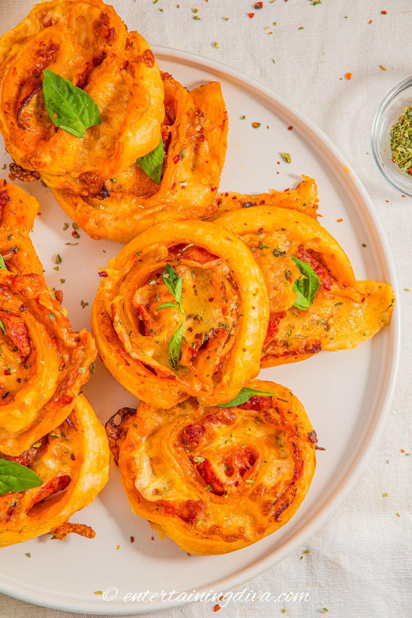 overhead view of pepperoni rollups on a plate