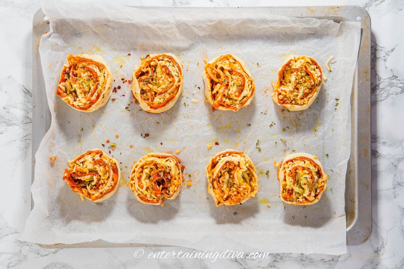 pepperoni pinwheels on a baking tray before being baked