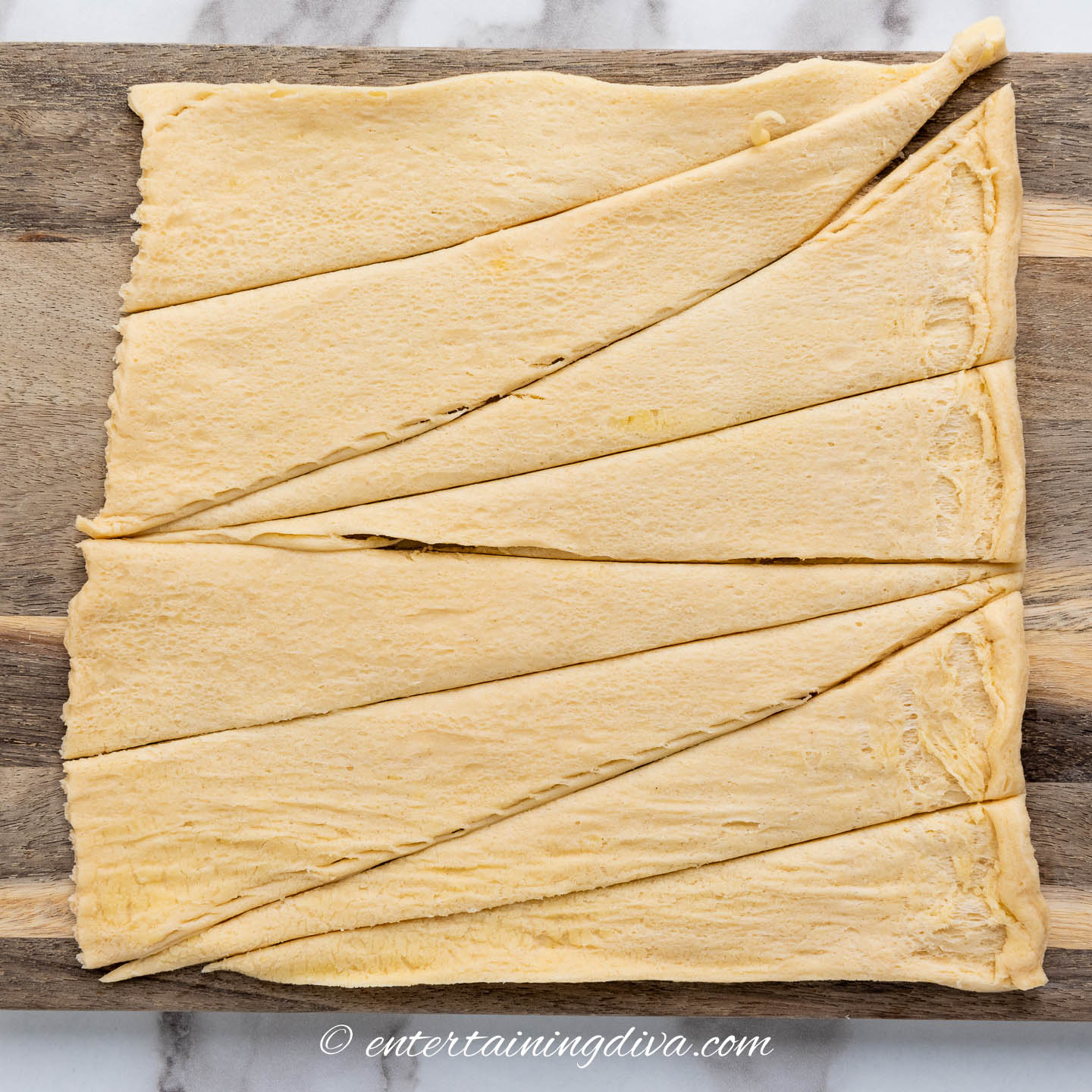 Crescent roll dough with the slices cut in half