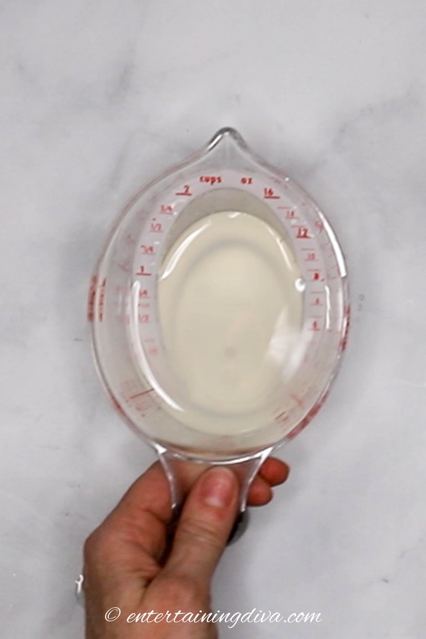lemonade and citron vodka in a measuring cup