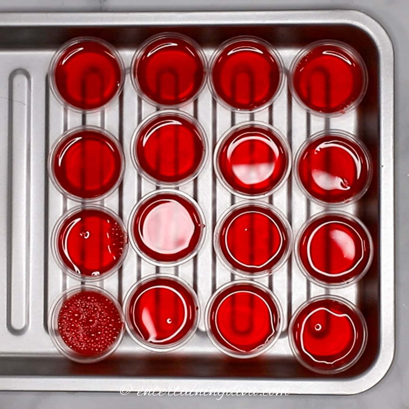 raspberry lemonade jello shots on a baking tray