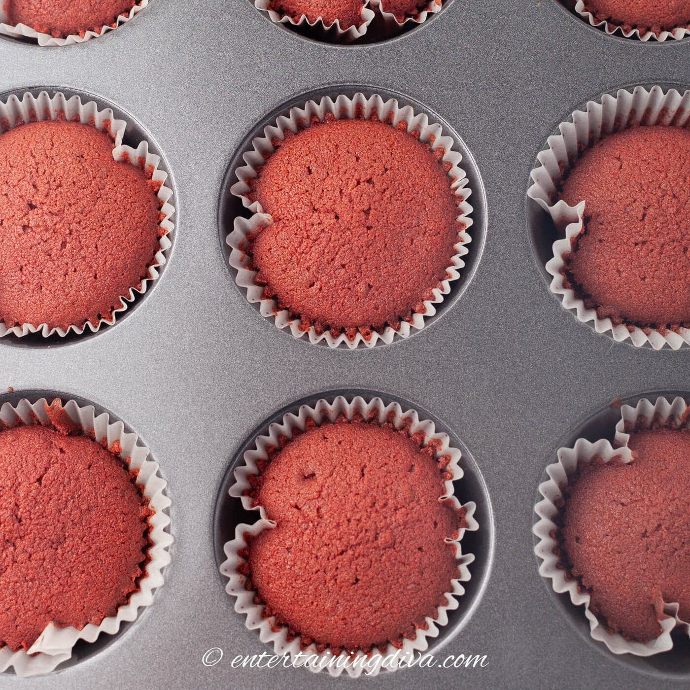 baked red velvet cupcakes in a muffin tin