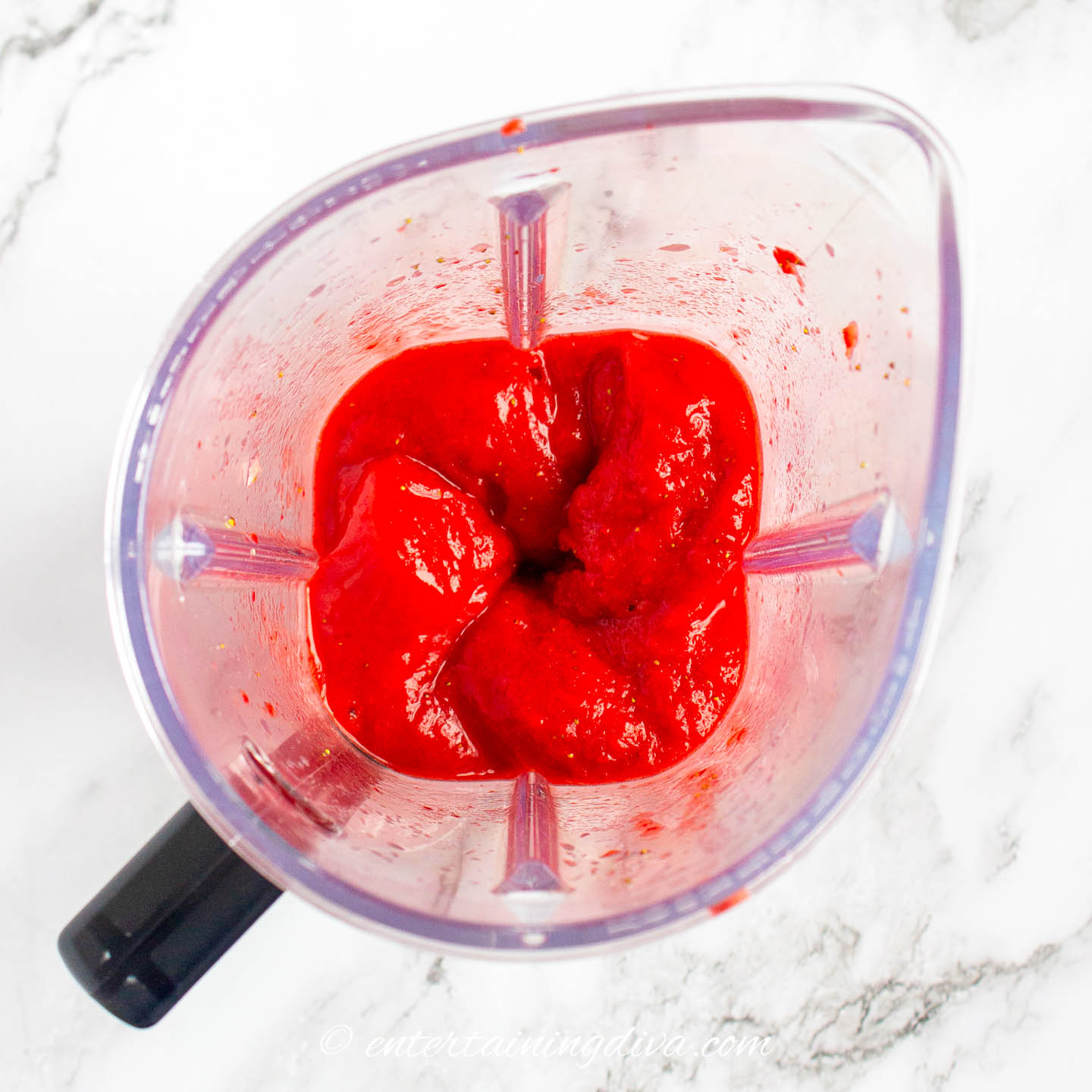 blended strawberries and honey in a blender