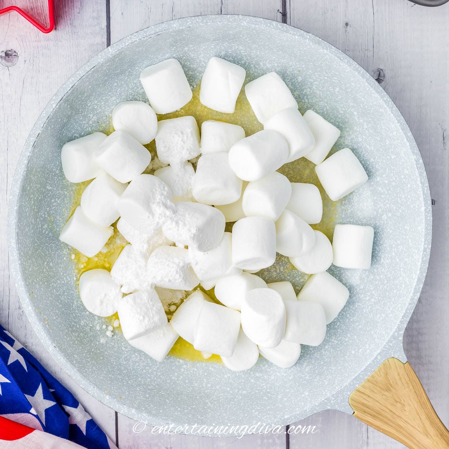 marshmallows, butter and powder sugar melting in a skillet