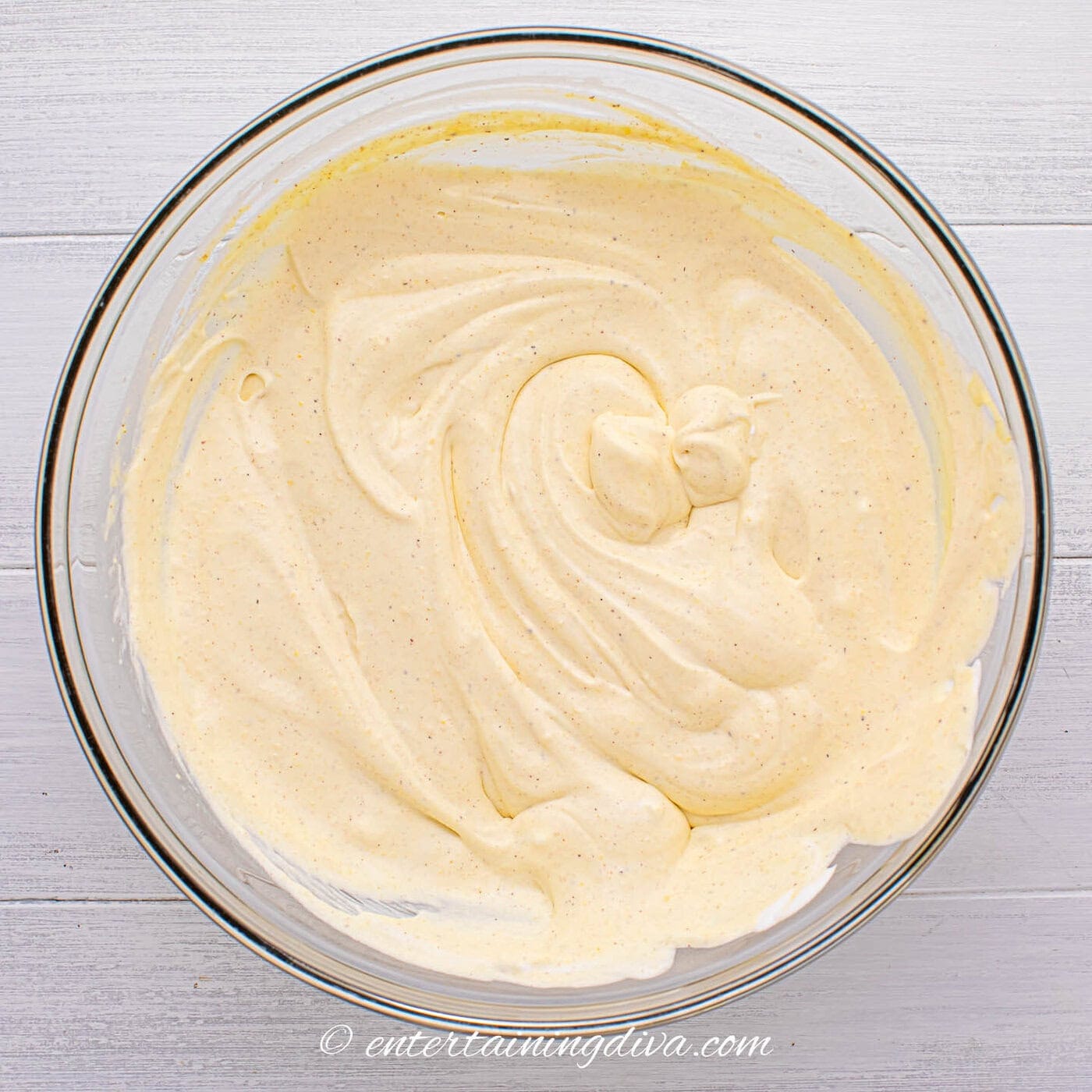 rumchata pudding shot mixture in a bowl after the whipped topping has been added