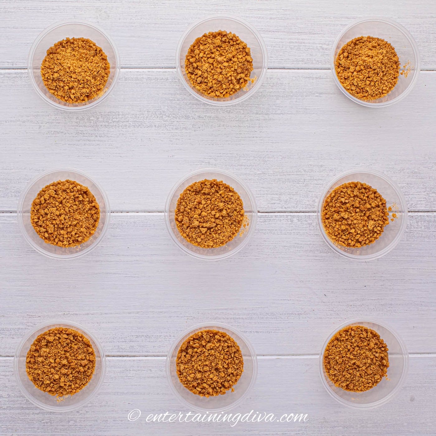 jello shot cups with the bottoms lined with crushed ginger snap cookies