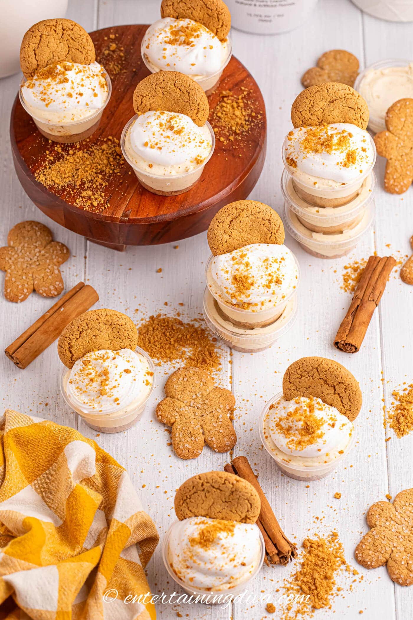RumChata Christmas pudding shots with gingerbread cookies and cinnamon sticks