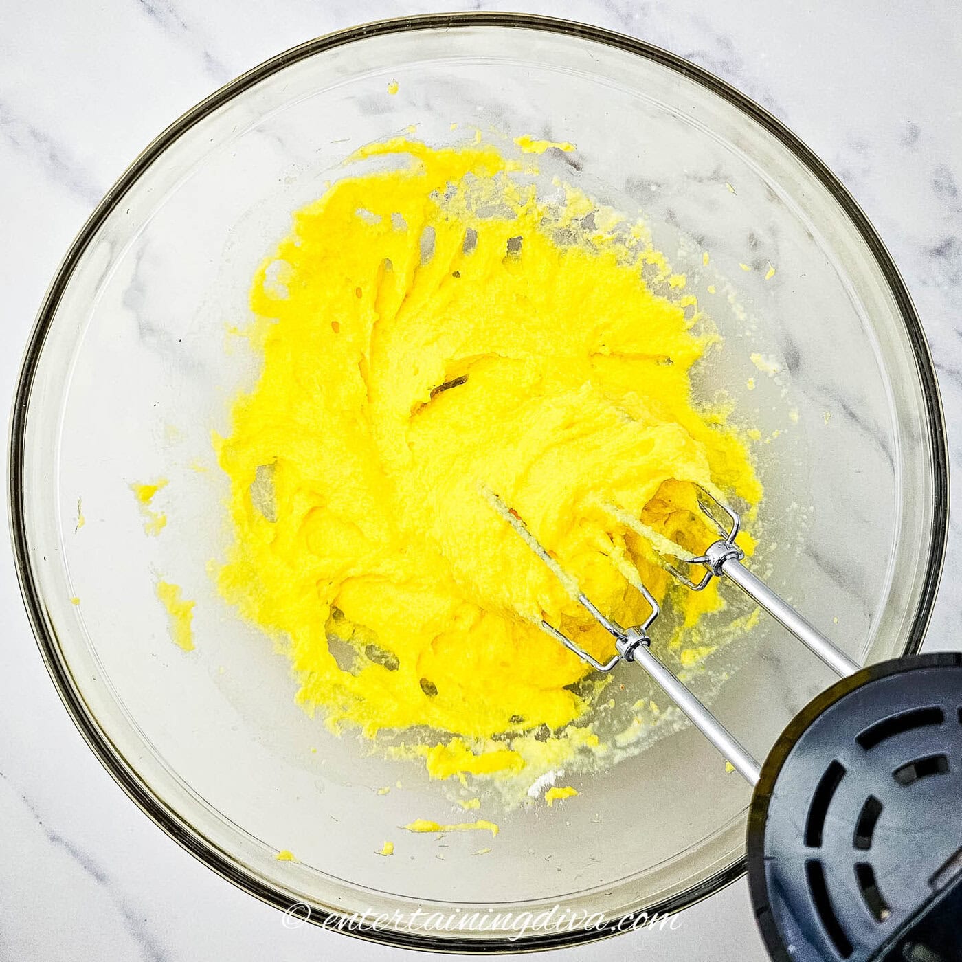 pudding mix in a bowl with a mixer