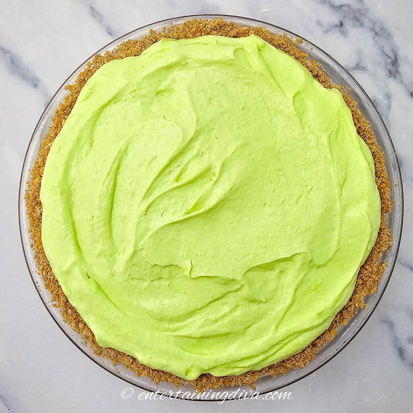 green shamrock shake pie in a graham cracker crust