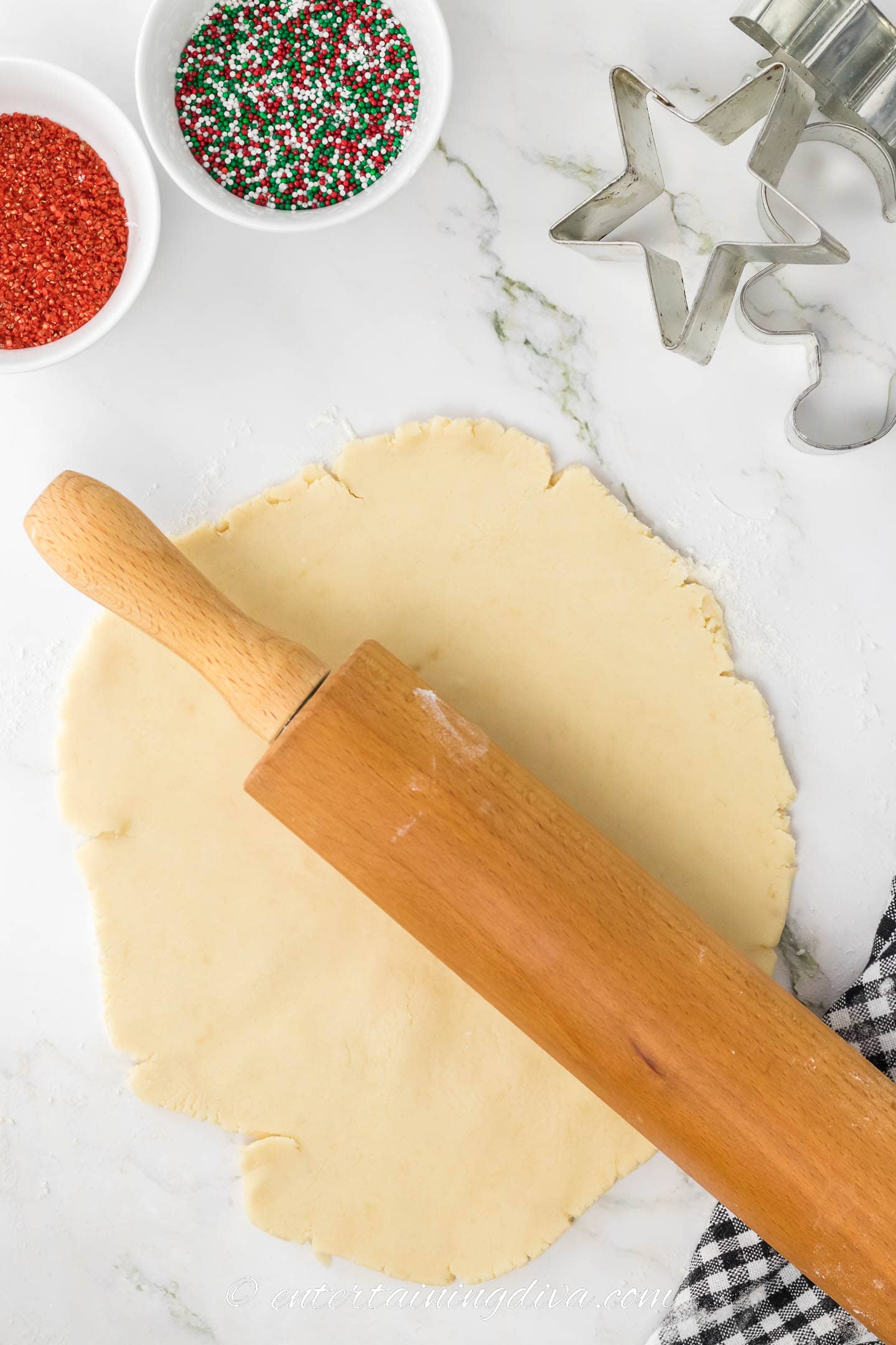 Shortbread cookie dough rolled out with a rolling pin