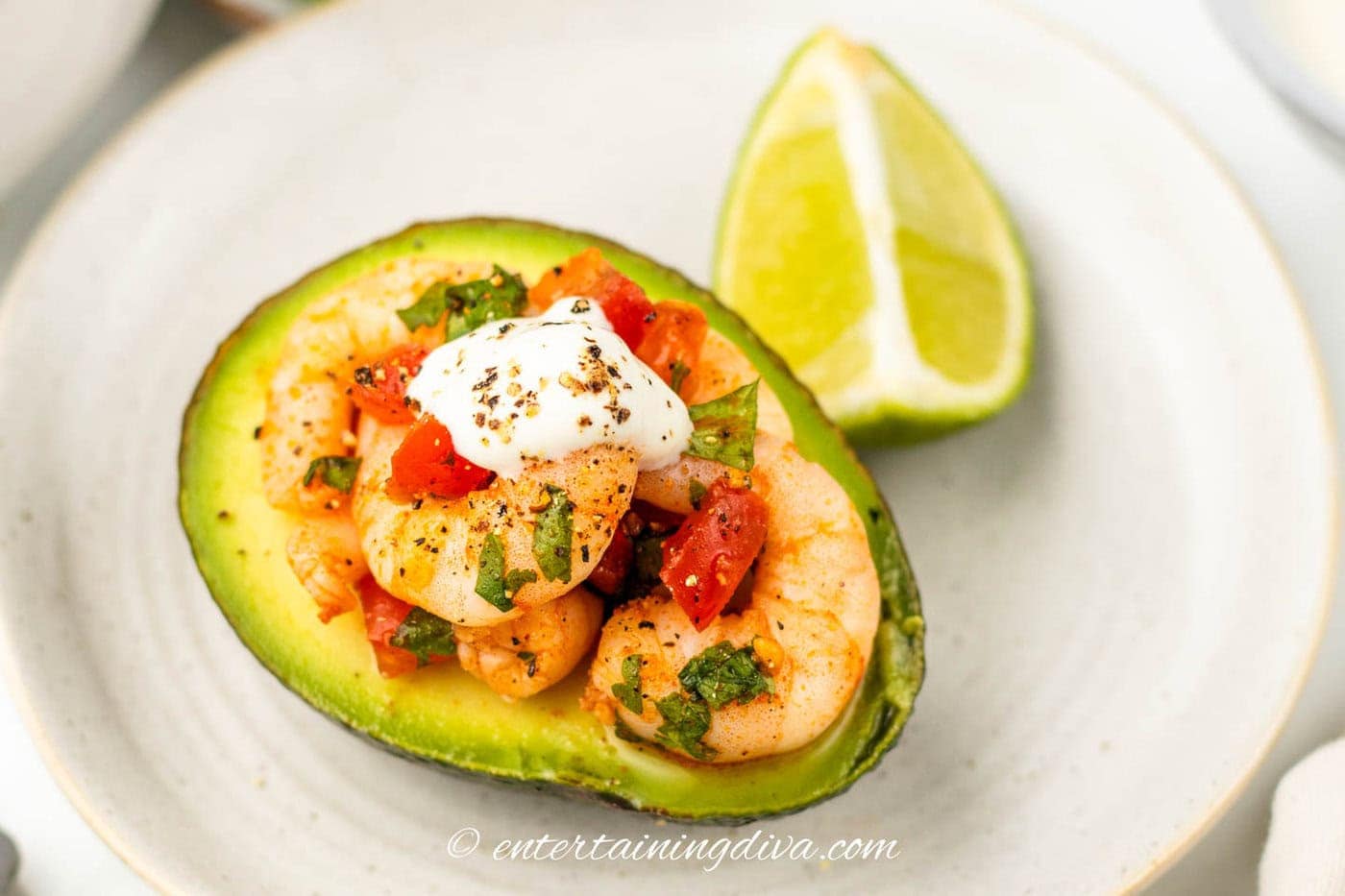 shrimp filled avocado with a dollop of sour cream