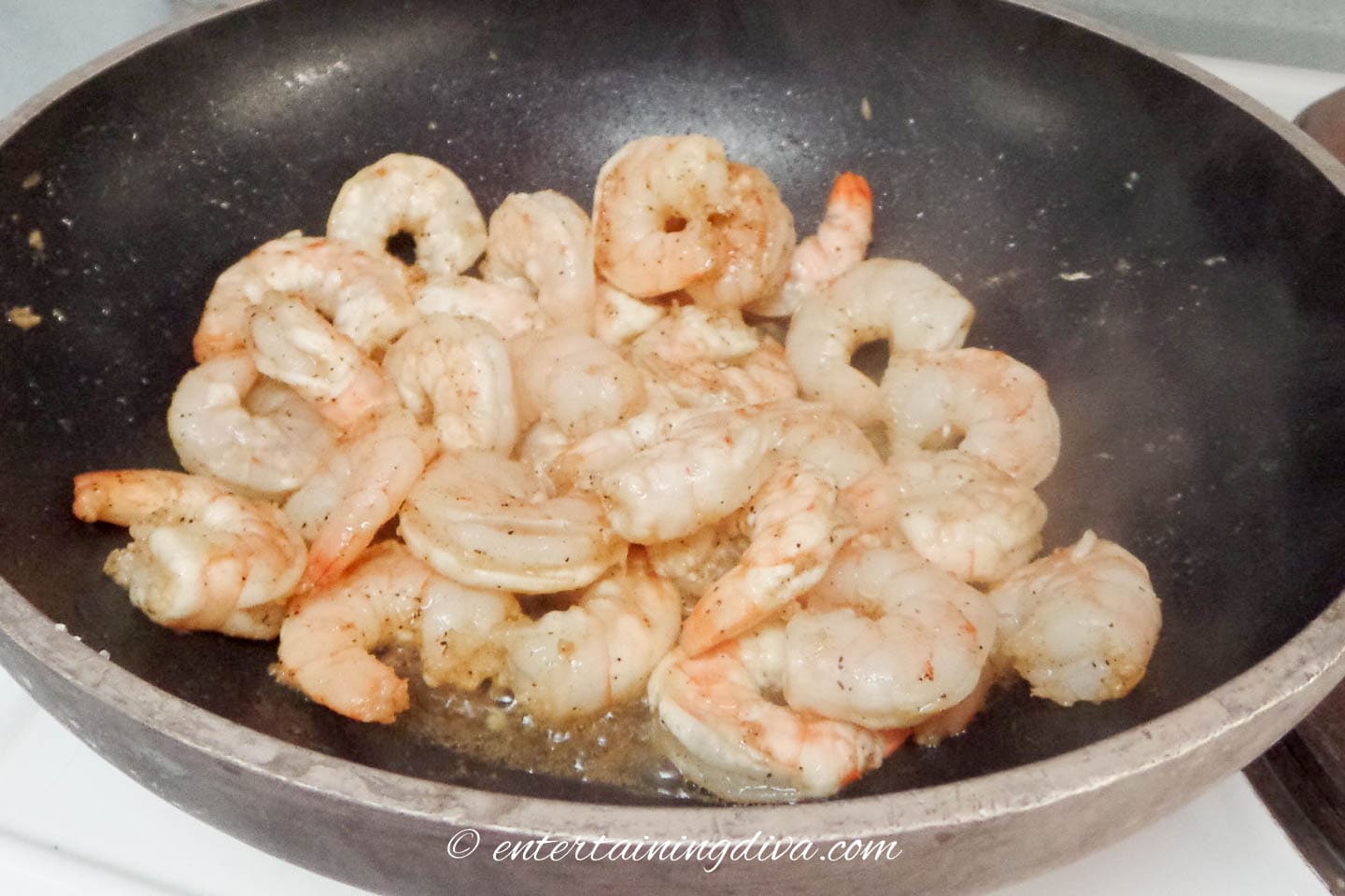sauteed shrimp in a frying pan