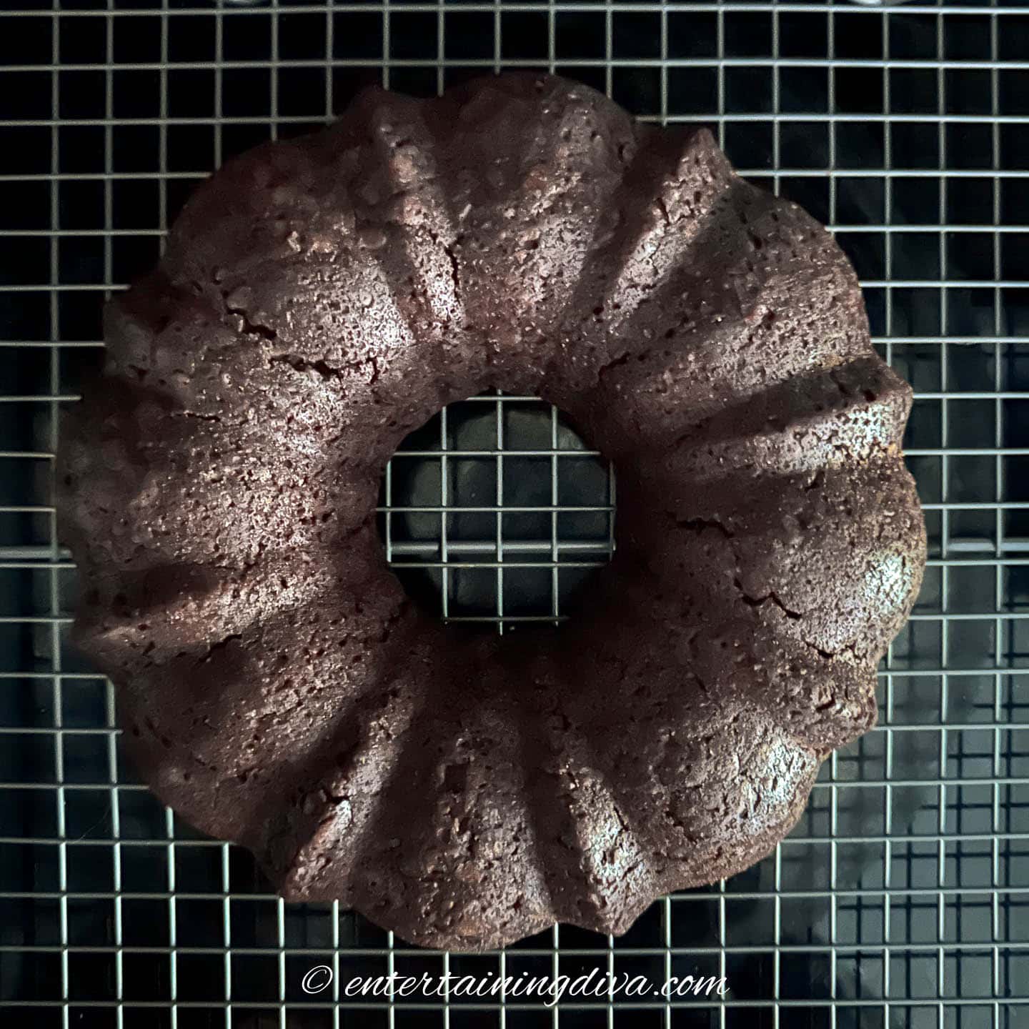 chocolate and coke soda cake on a wire cooling rack