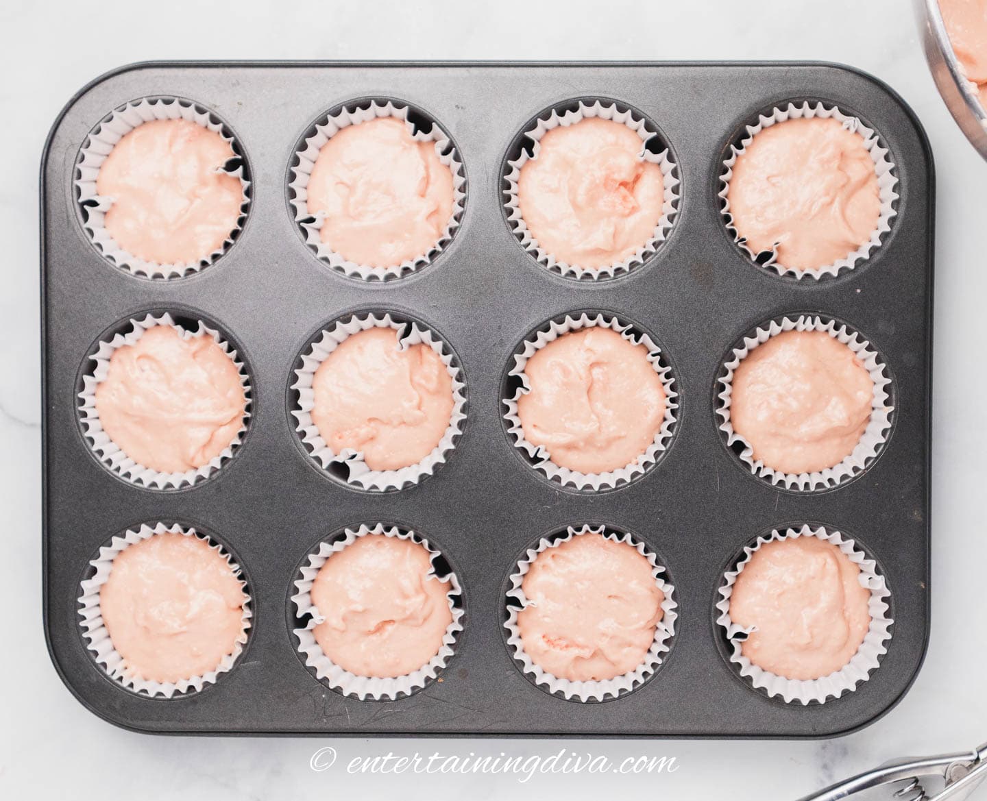soda cupcakes in a cupcake tin before baking