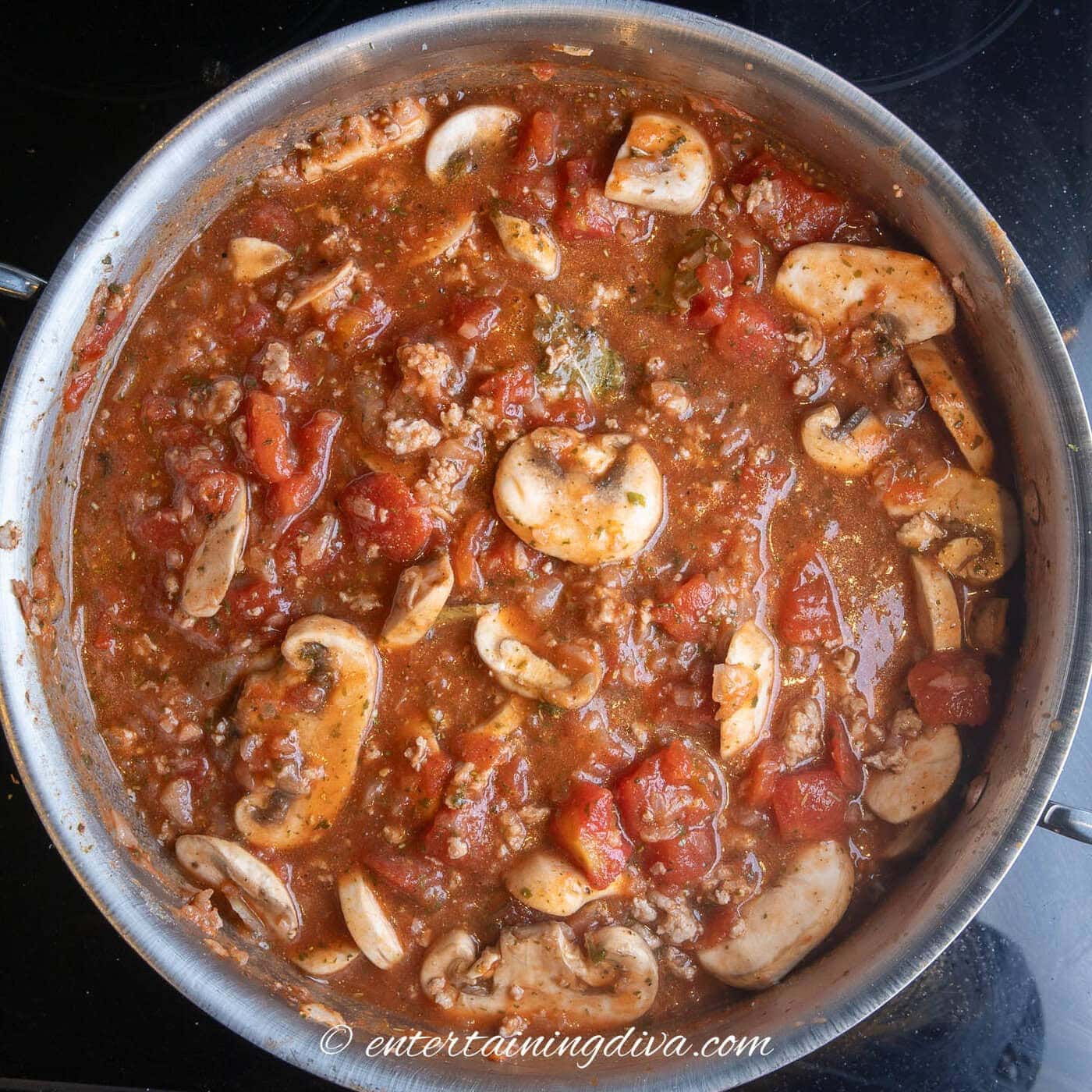 spaghetti meat sauce with mushrooms in a stock pot