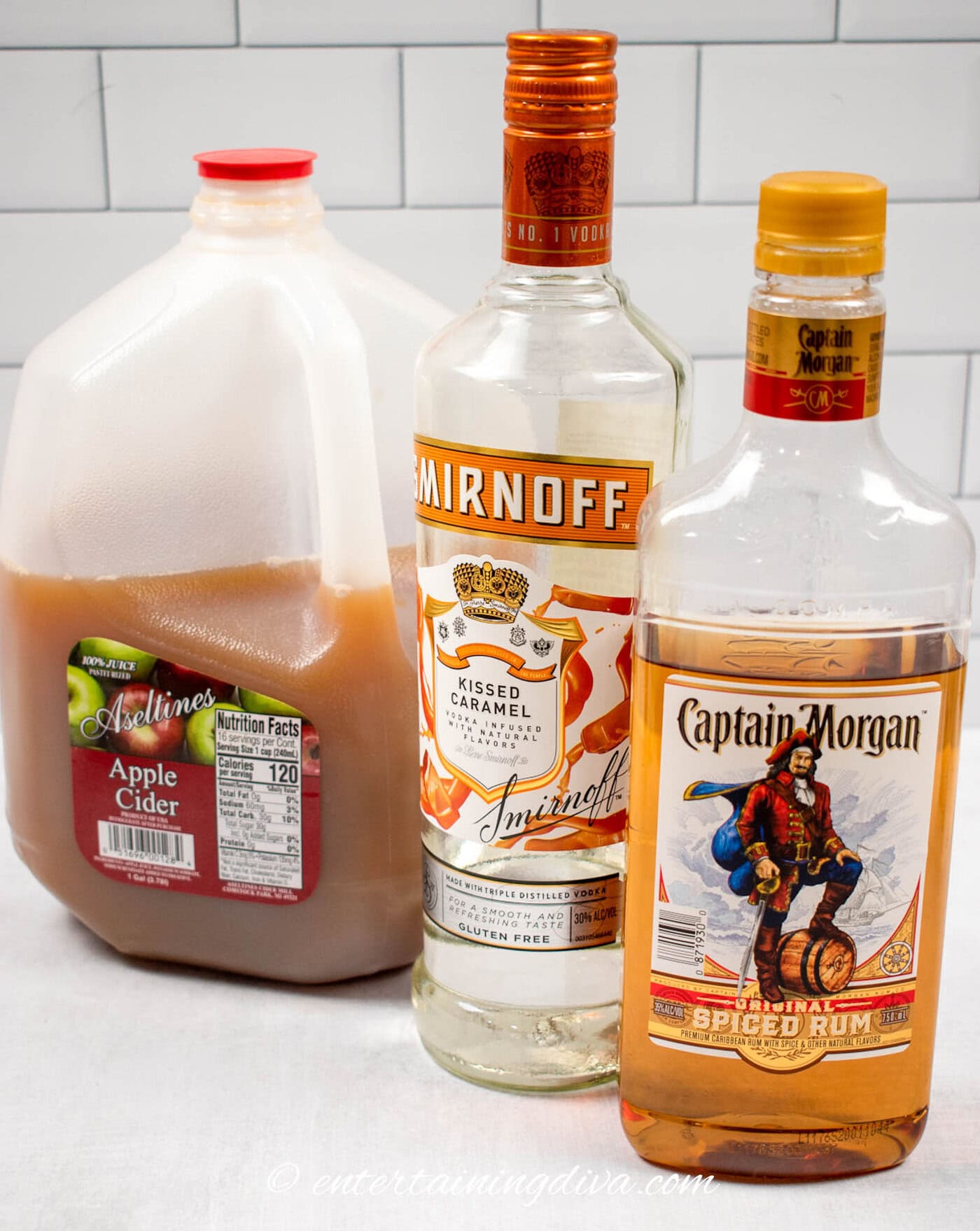 spiked caramel apple cider ingredients: apple cider, caramel vodka and spiced rum