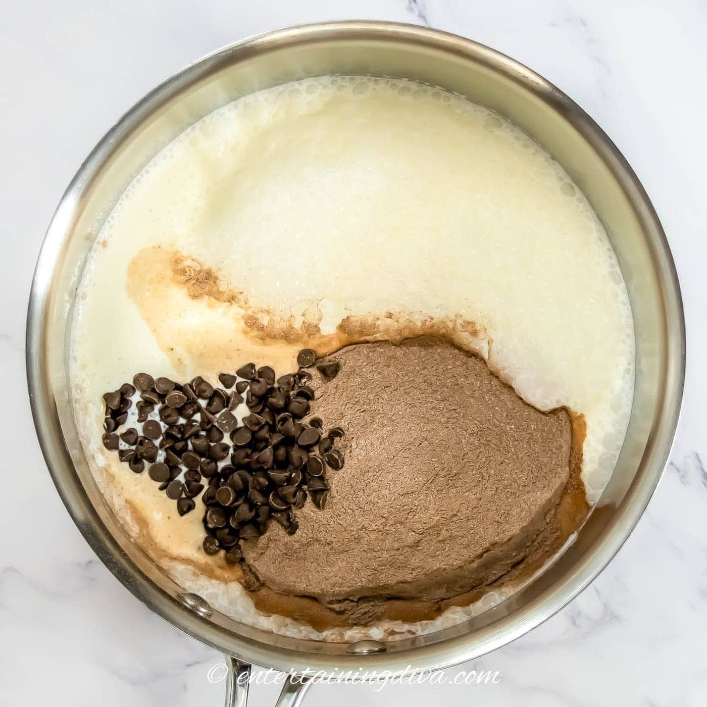 milk, hot chocolate mix and chocolate chips in a small saucepan
