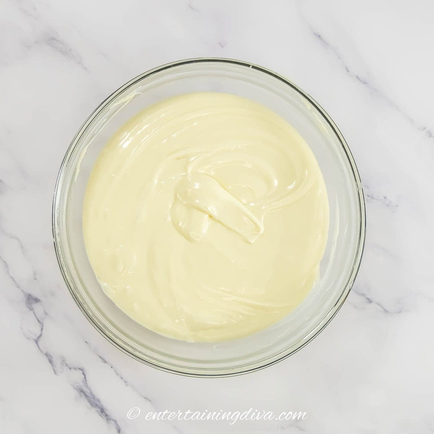 melted white chocolate chips in a bowl