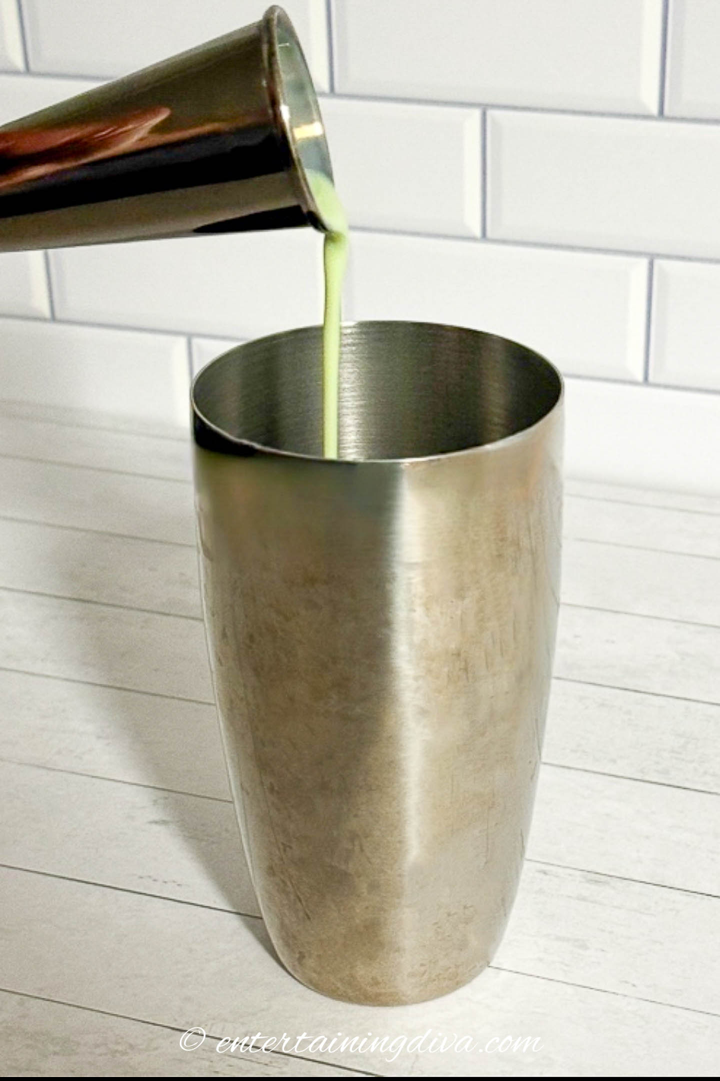 Bailey's Vanilla Mint Shake being poured into a shaker
