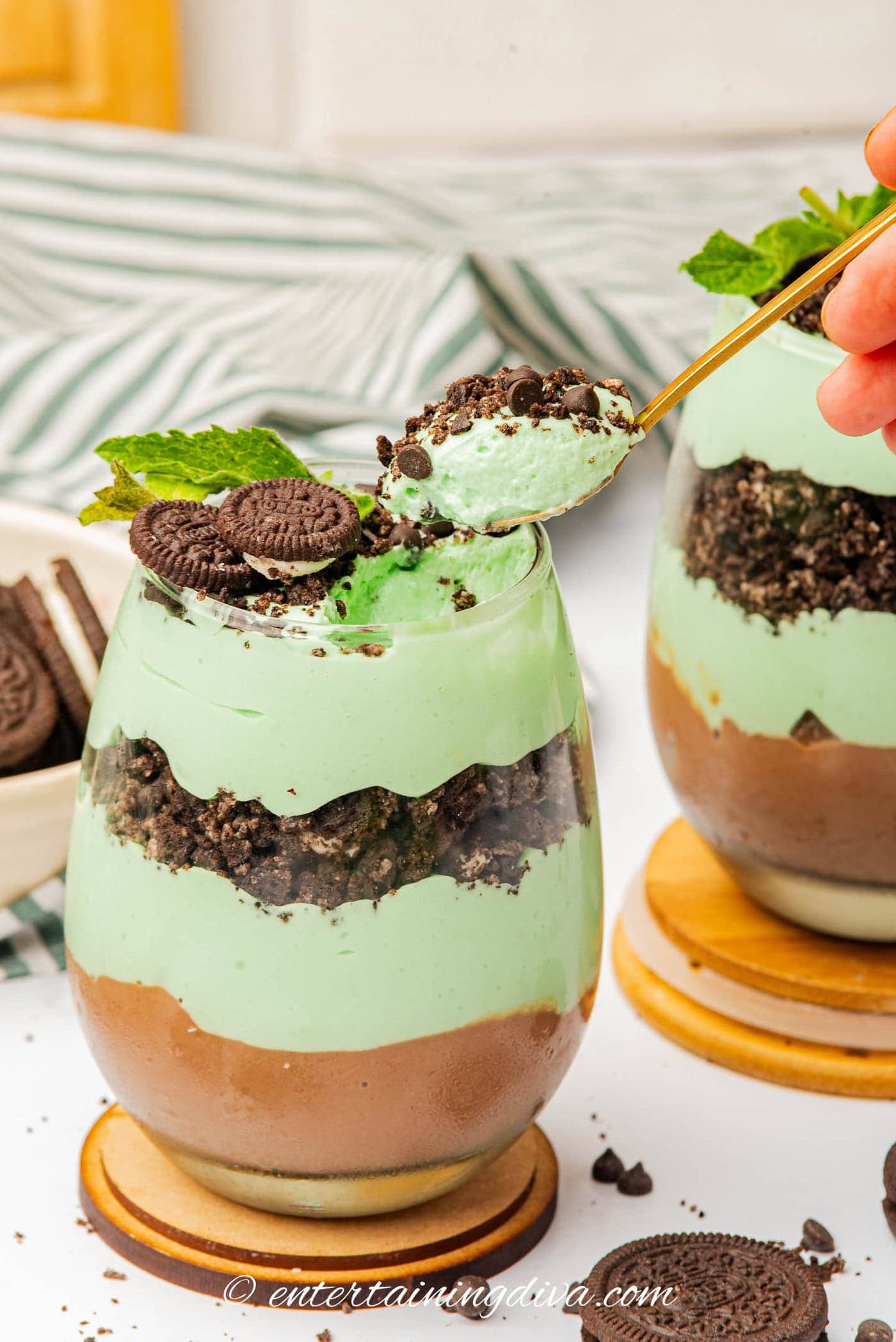 A spoonful of St Patrick's Day parfait being taken out of the parfait glass