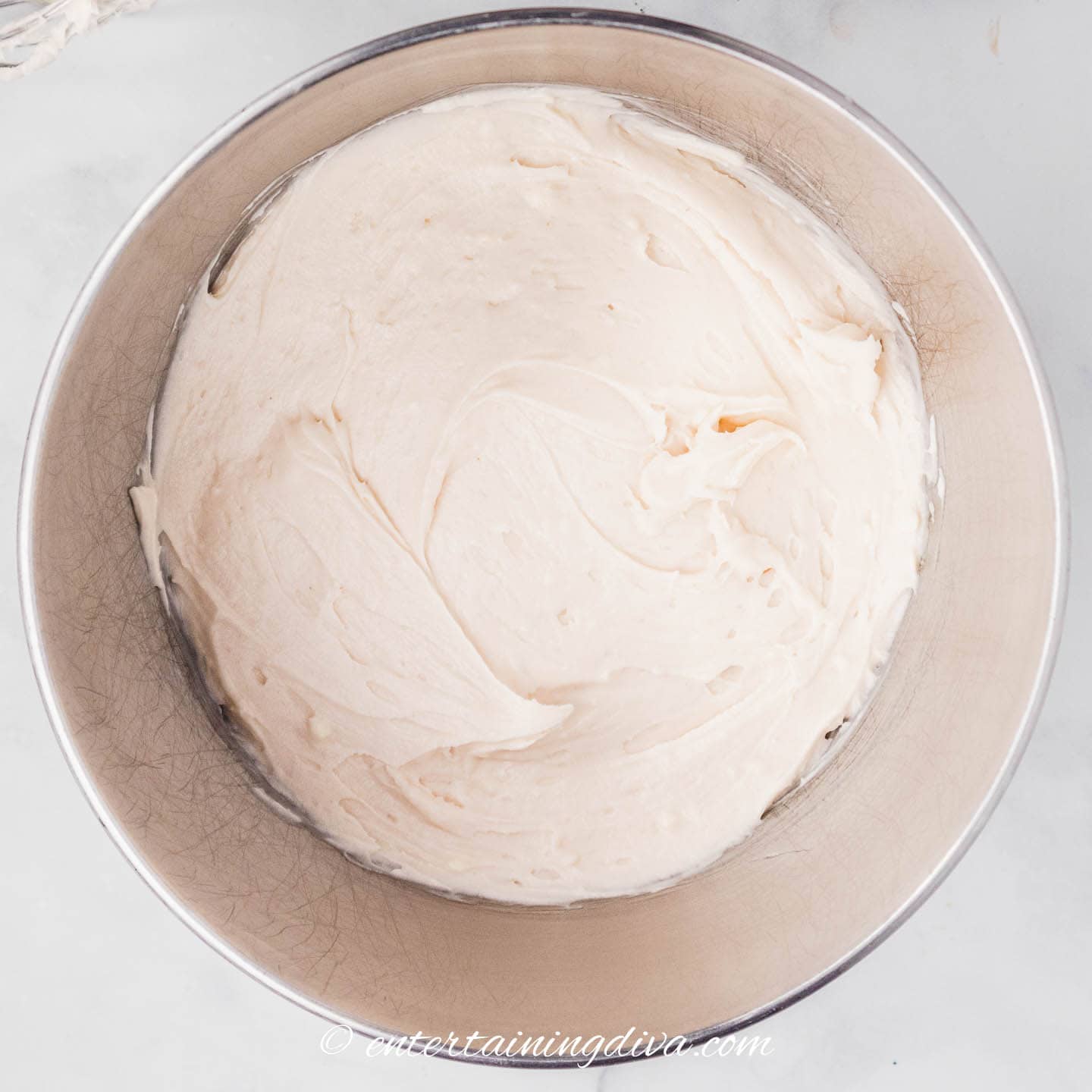 strawberry cream cheese frosting in a mixing bowl