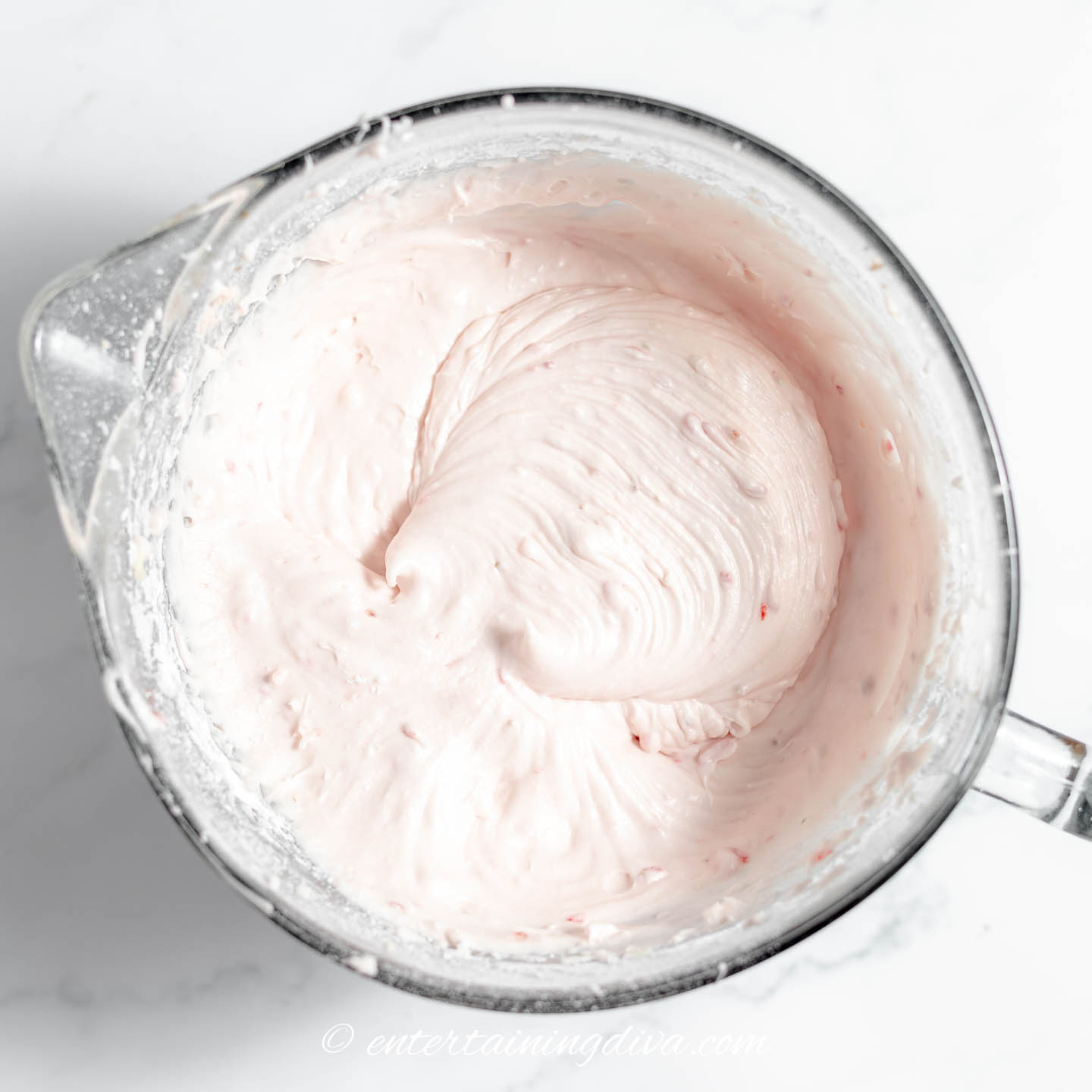 strawberry frosting in a bowl