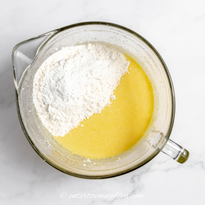 flour in a mixing bowl with lemon cake batter