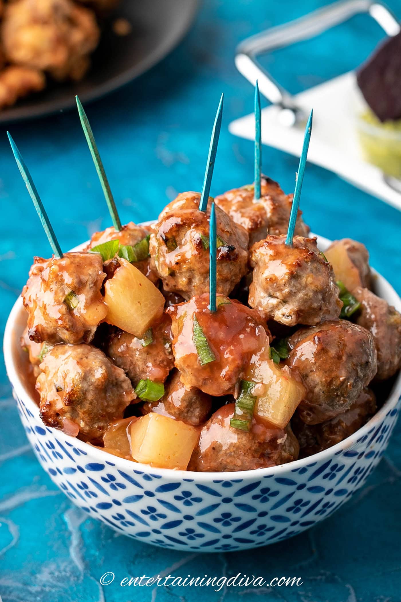 sweet and sour meatballs with pineapple in a bowl