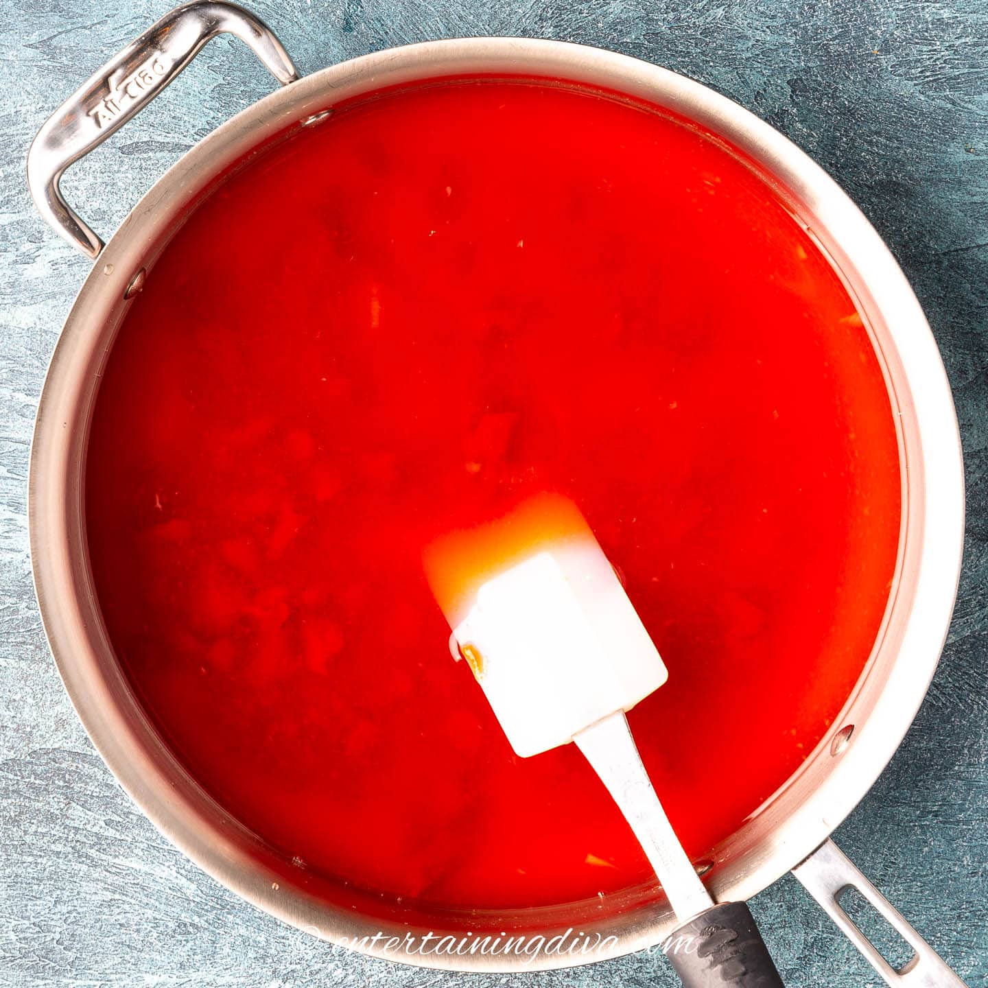 Sweet and sour sauce mixed in a saucepan
