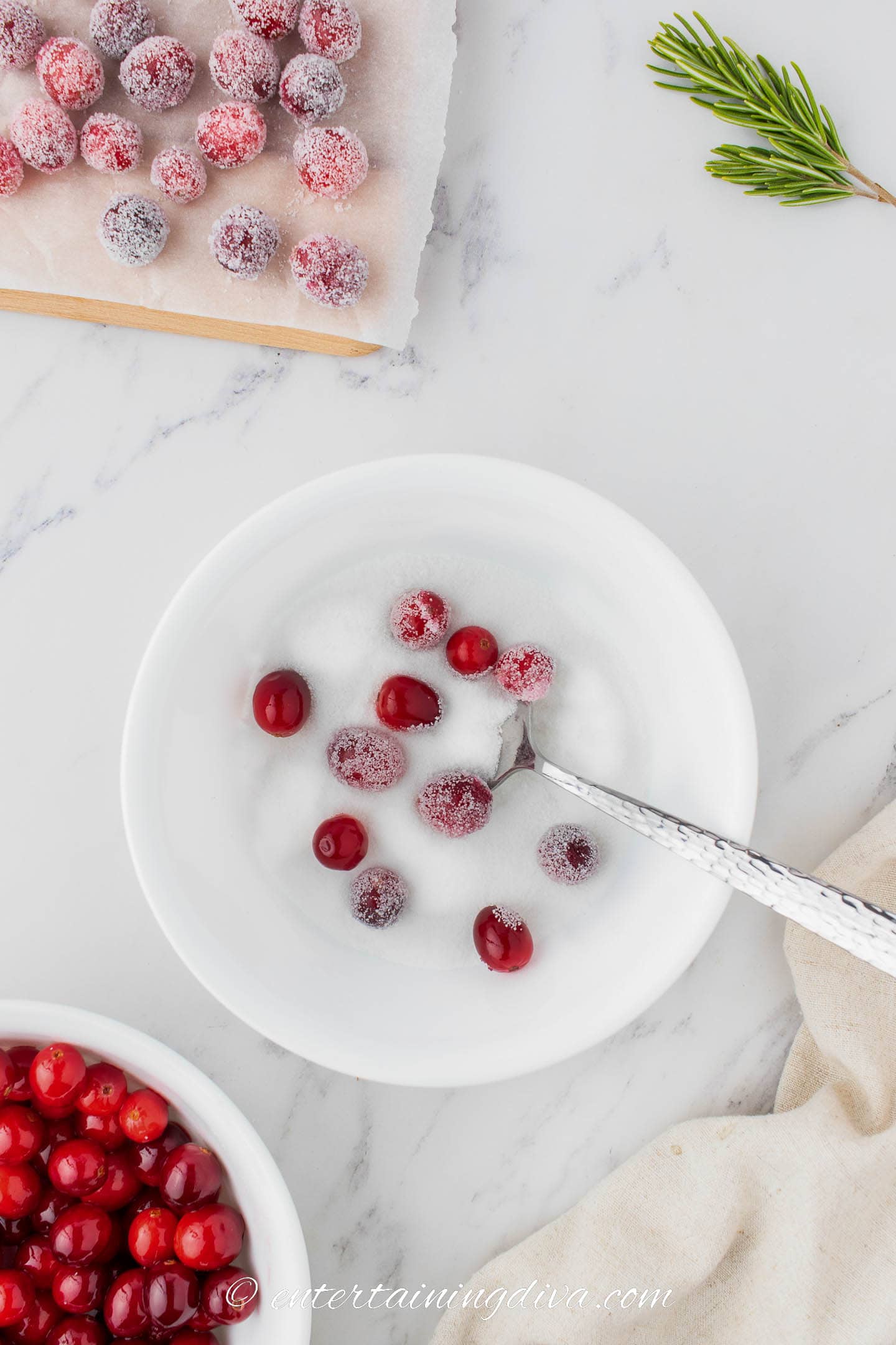 cranberries being rolled in sugar