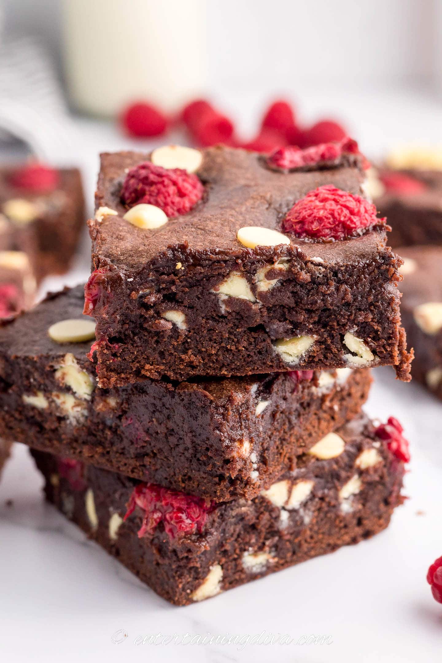 white chocolate raspberry brownie with a bite taken out of it