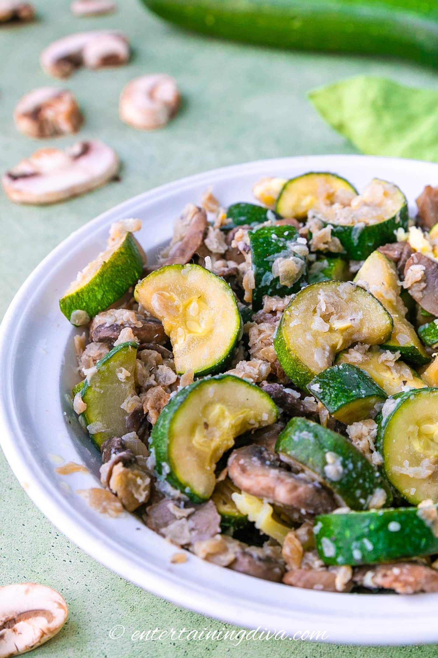zucchini mushroom stir fry in a serving bowl