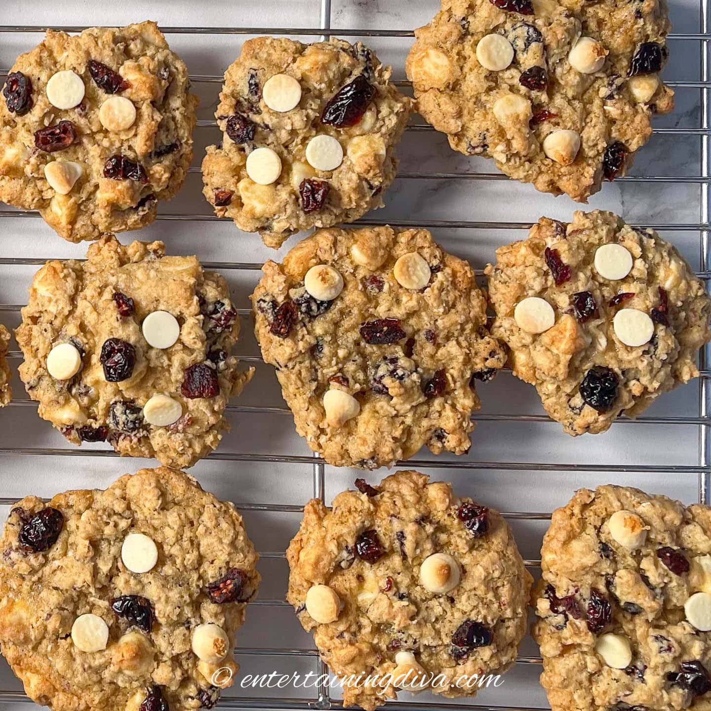 cranberry white chocolate oatmeal cookies on a wire rack