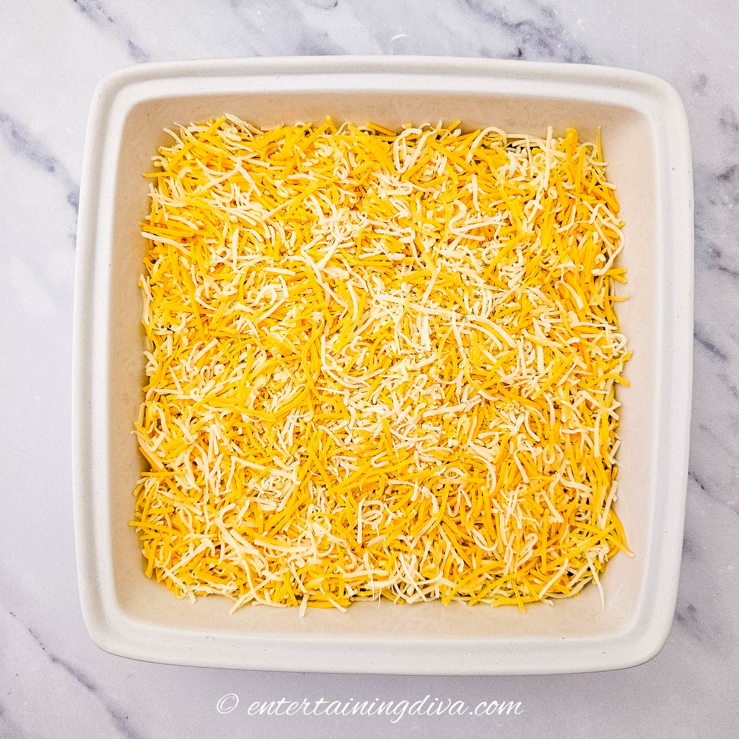 a layer of grated cheese in a 7-layer dip
