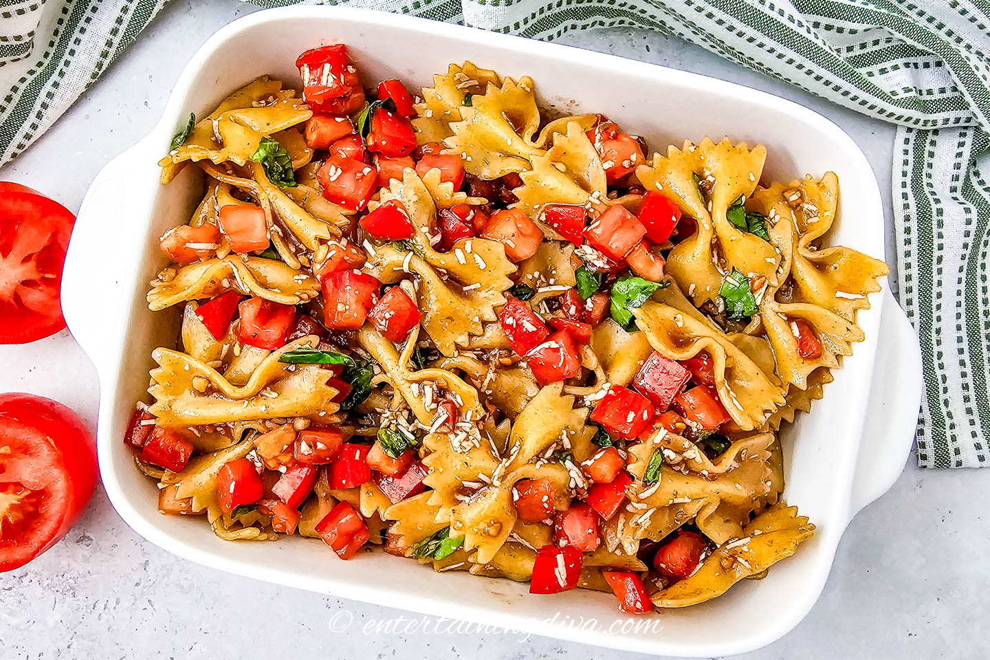 Bruschetta pasta salad served in a white casserole dish