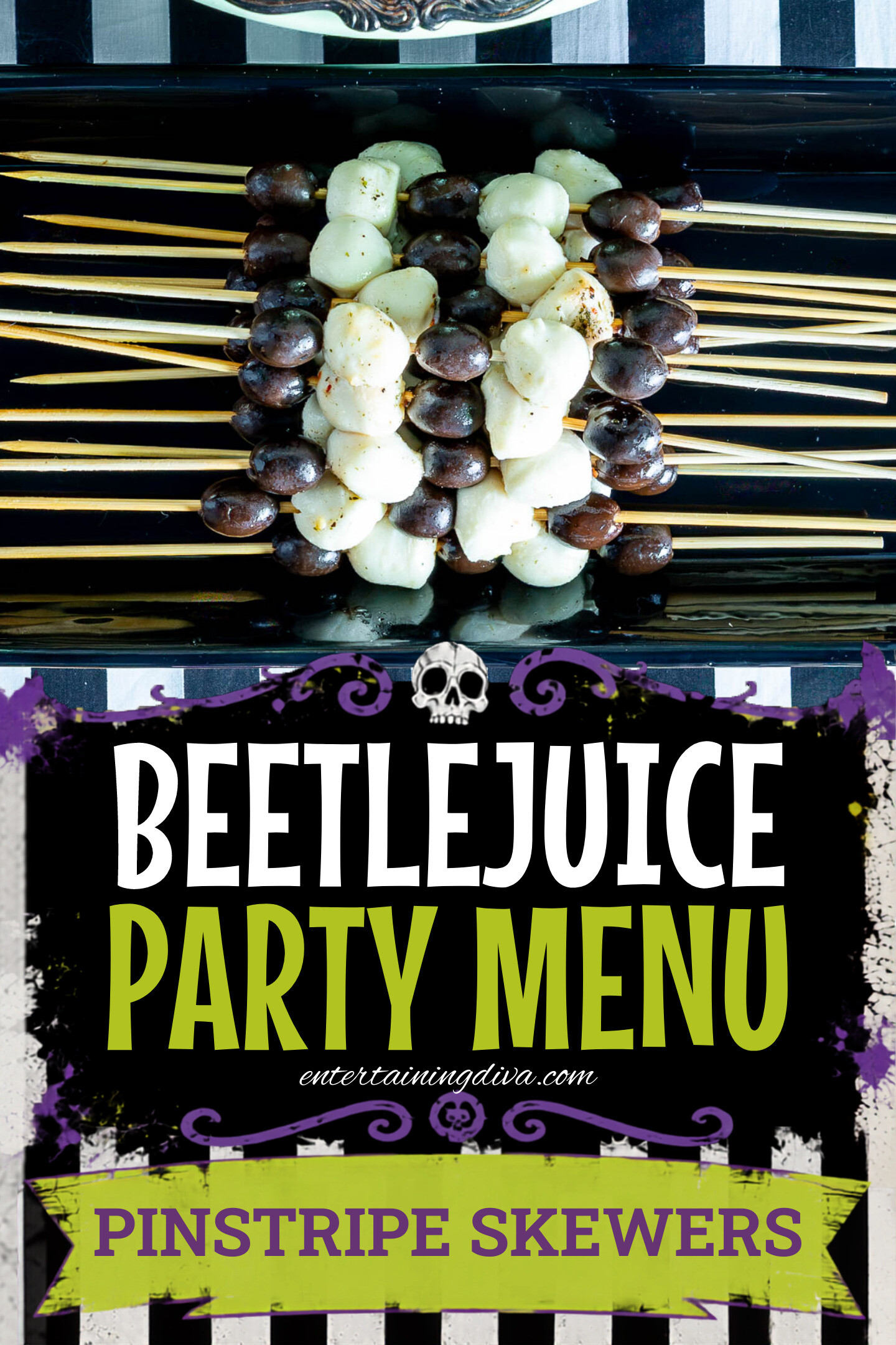 Skewers with alternating black grapes and small mozzarella balls arranged on a black rectangular platter.