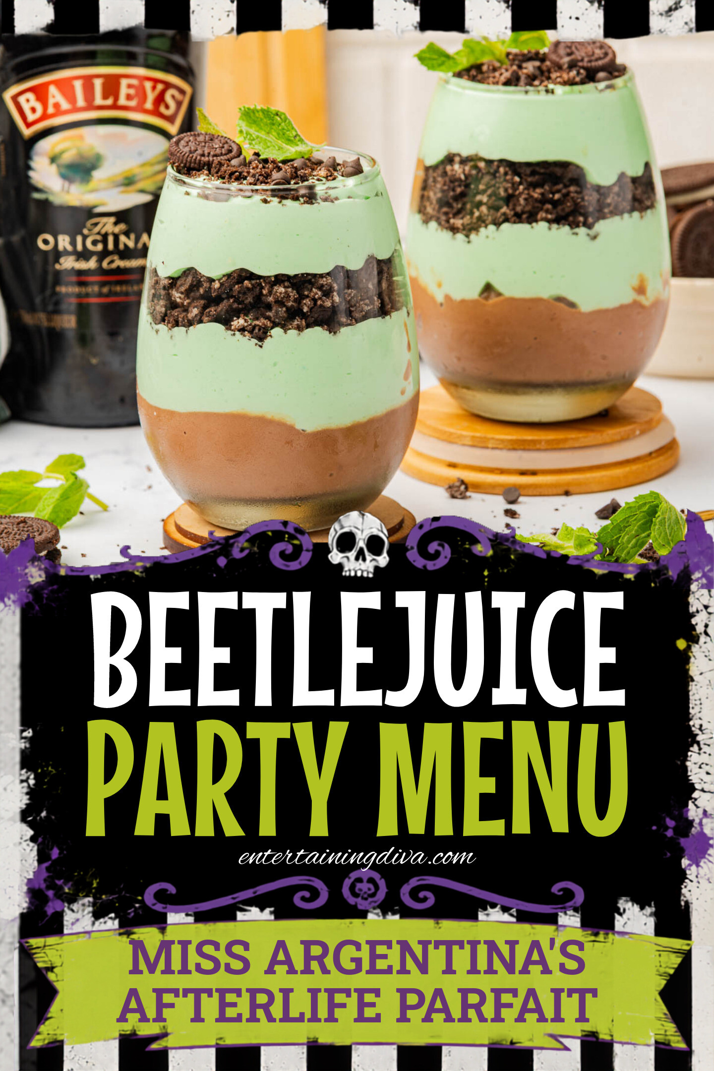 Two layered dessert glasses with chocolate and mint cream, topped with crushed Oreos and mint leaves, are set on coasters next to a bottle of Baileys and whole Oreos.