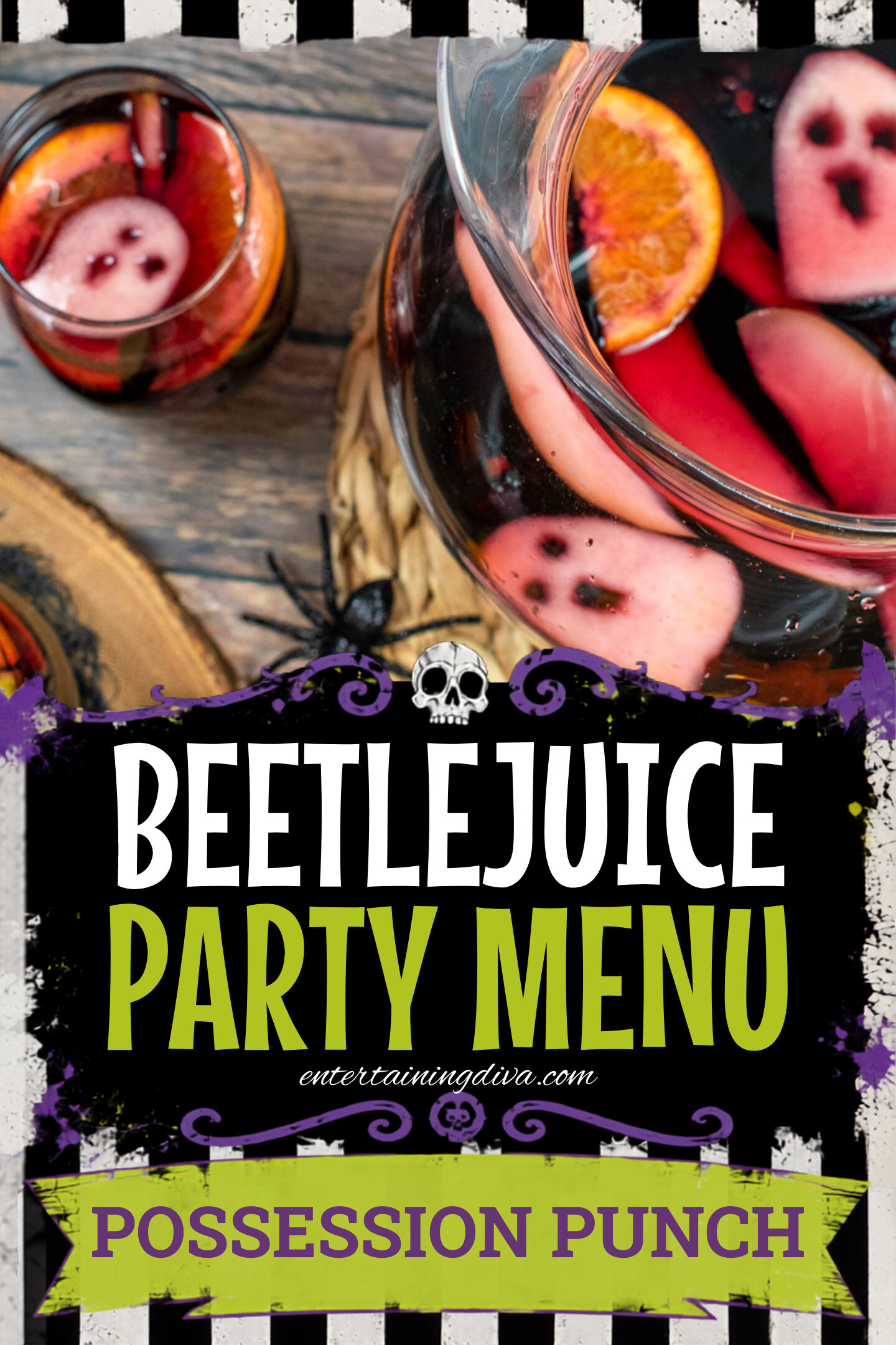 A pitcher and glasses of dark red punch with orange slices and apple pieces shaped like ghosts, on a wooden table with black plastic spiders.