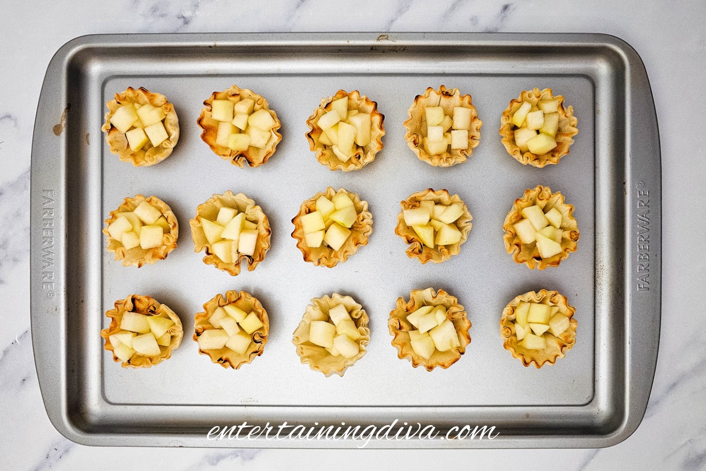Diced pear added to mini phyllo shells