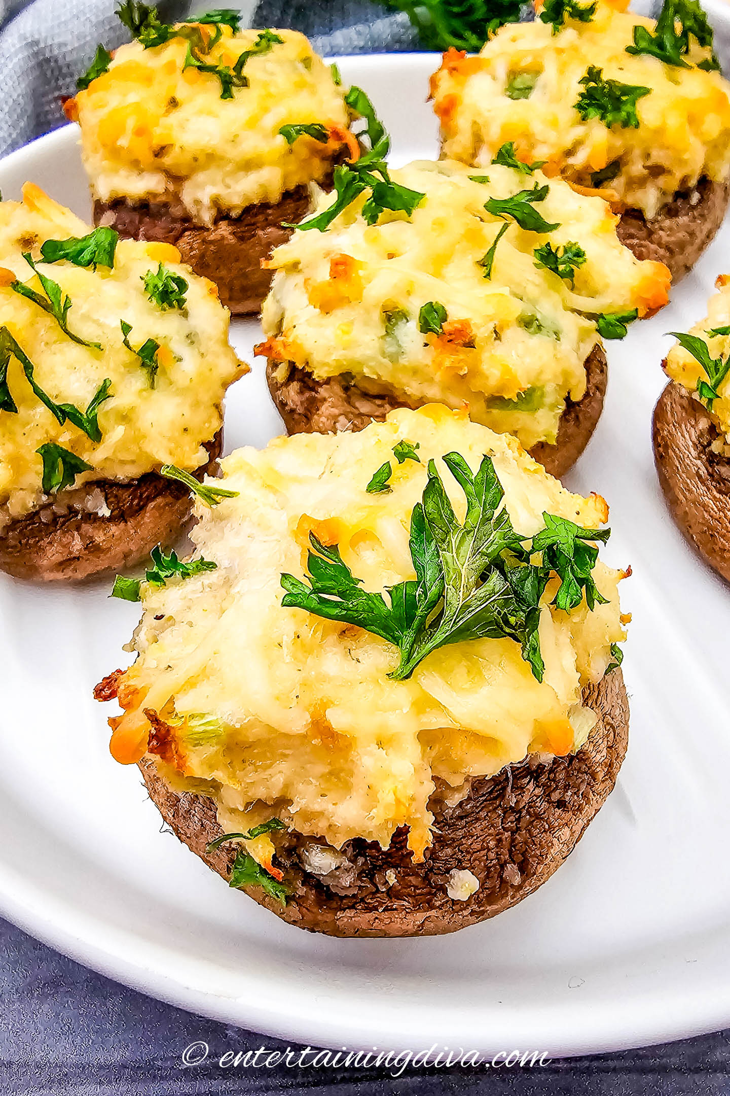 Close up of crab stuffed mushrooms on a plate