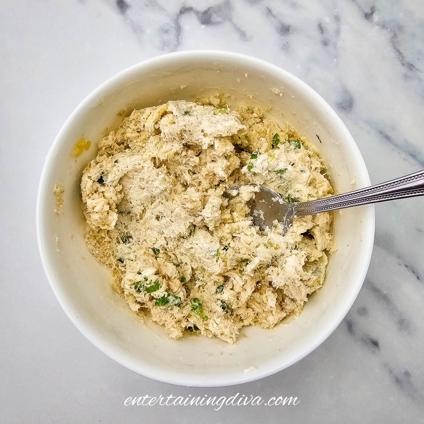 A bowl filled with a crab stuffing mixture