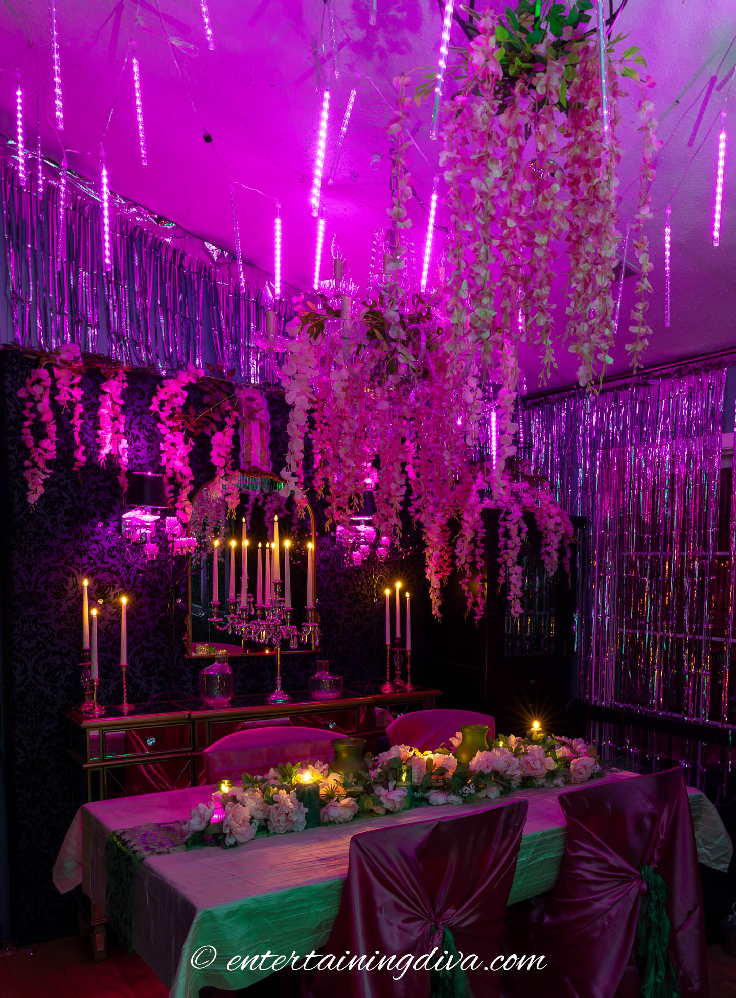 Pink meteor shower lights hung from the ceiling at Wicked Halloween party