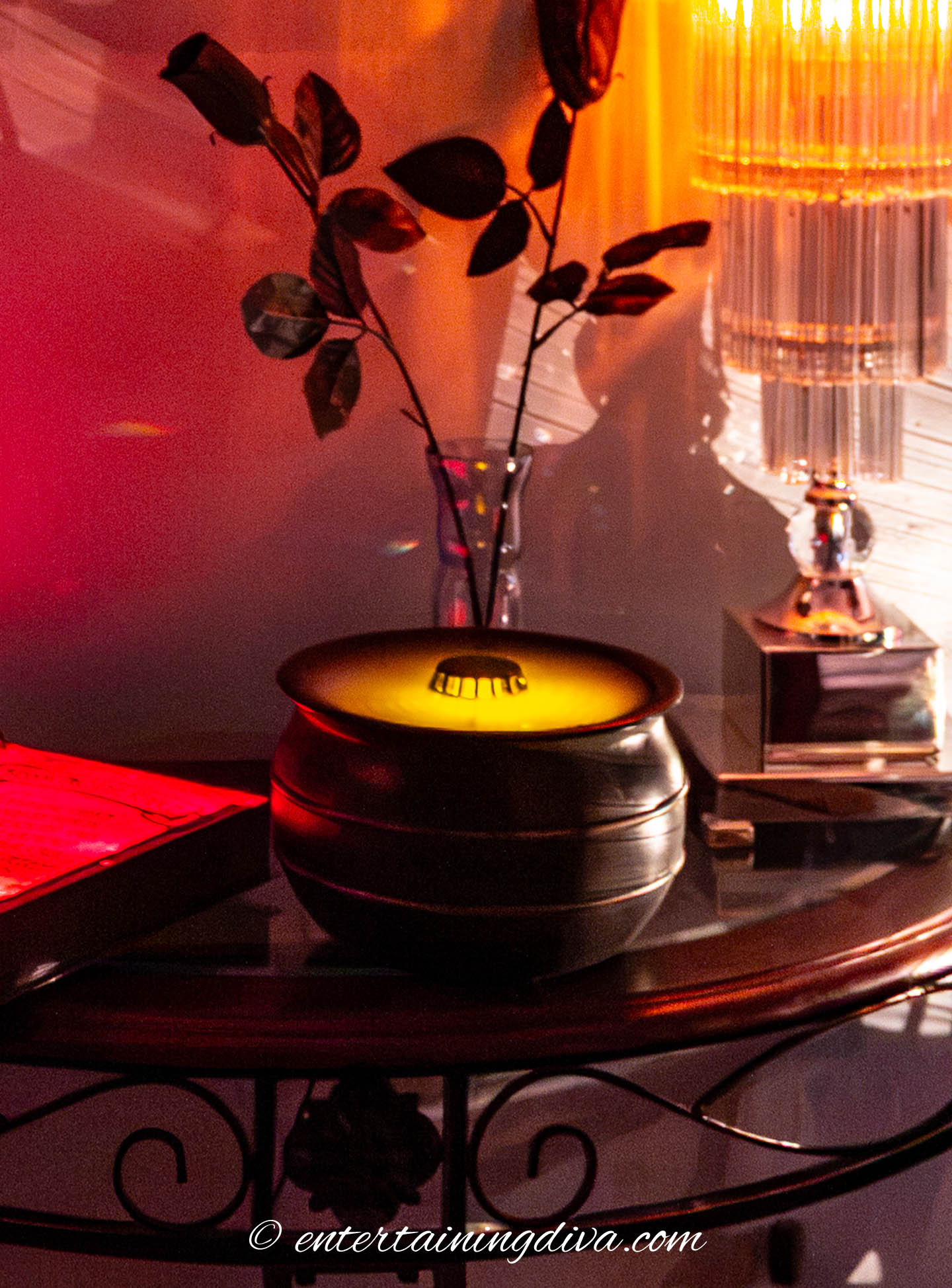 A lighted "boiling cauldron" prop in a Halloween haunted house party