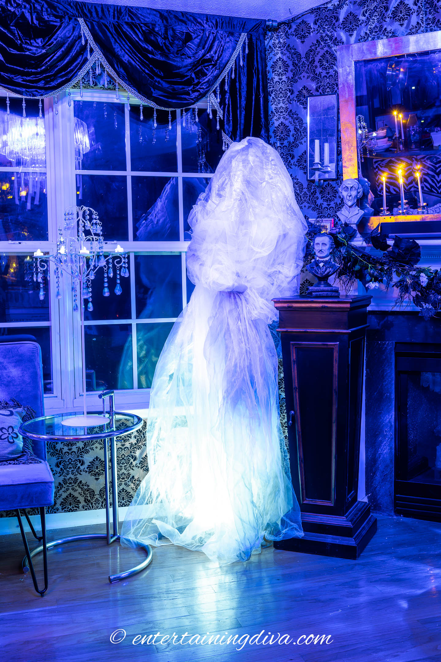 A ghost bride in a haunted house lit with an uplight
