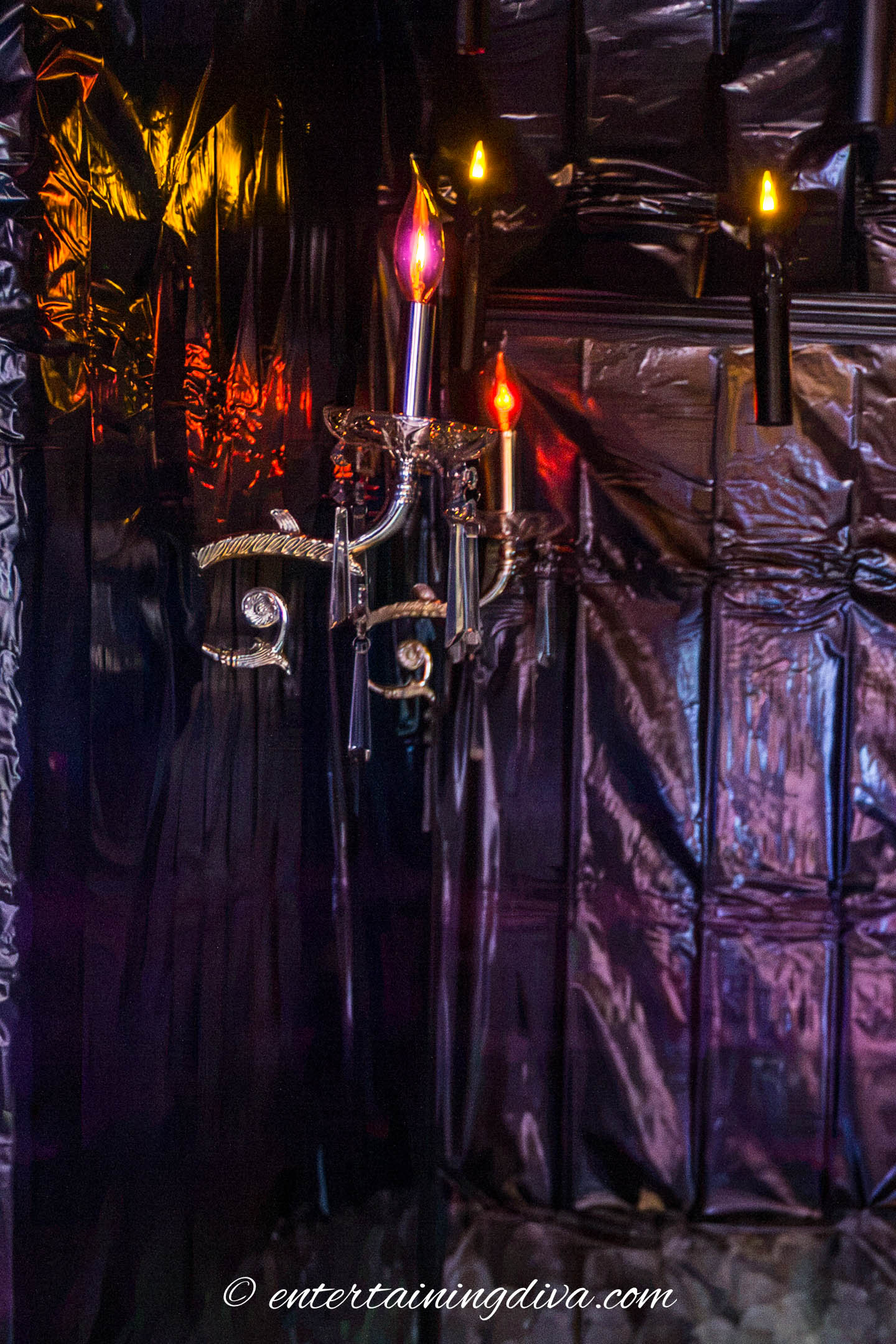 Flicker bulbs in wall sconces in a Halloween haunted house hallway