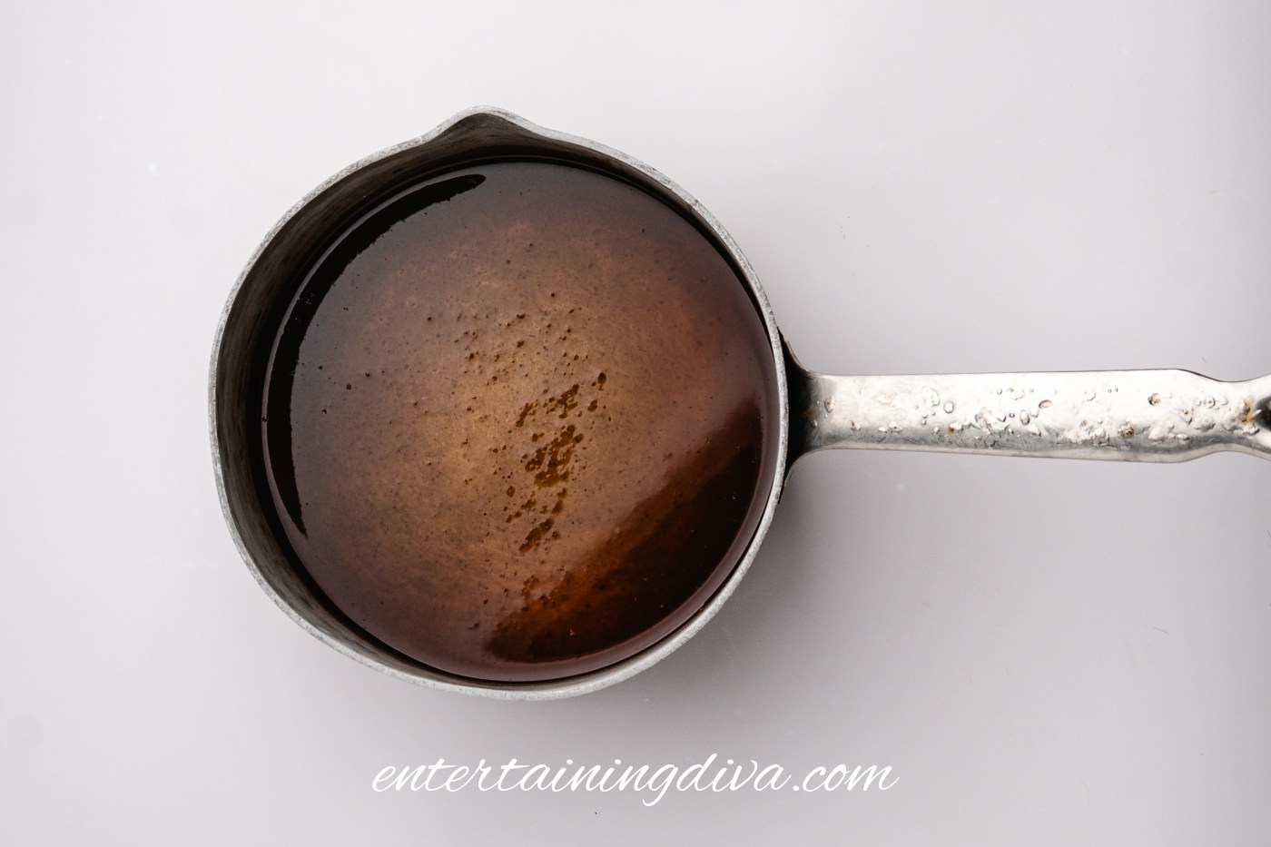 Smooth apple butter mixture in a saucepan